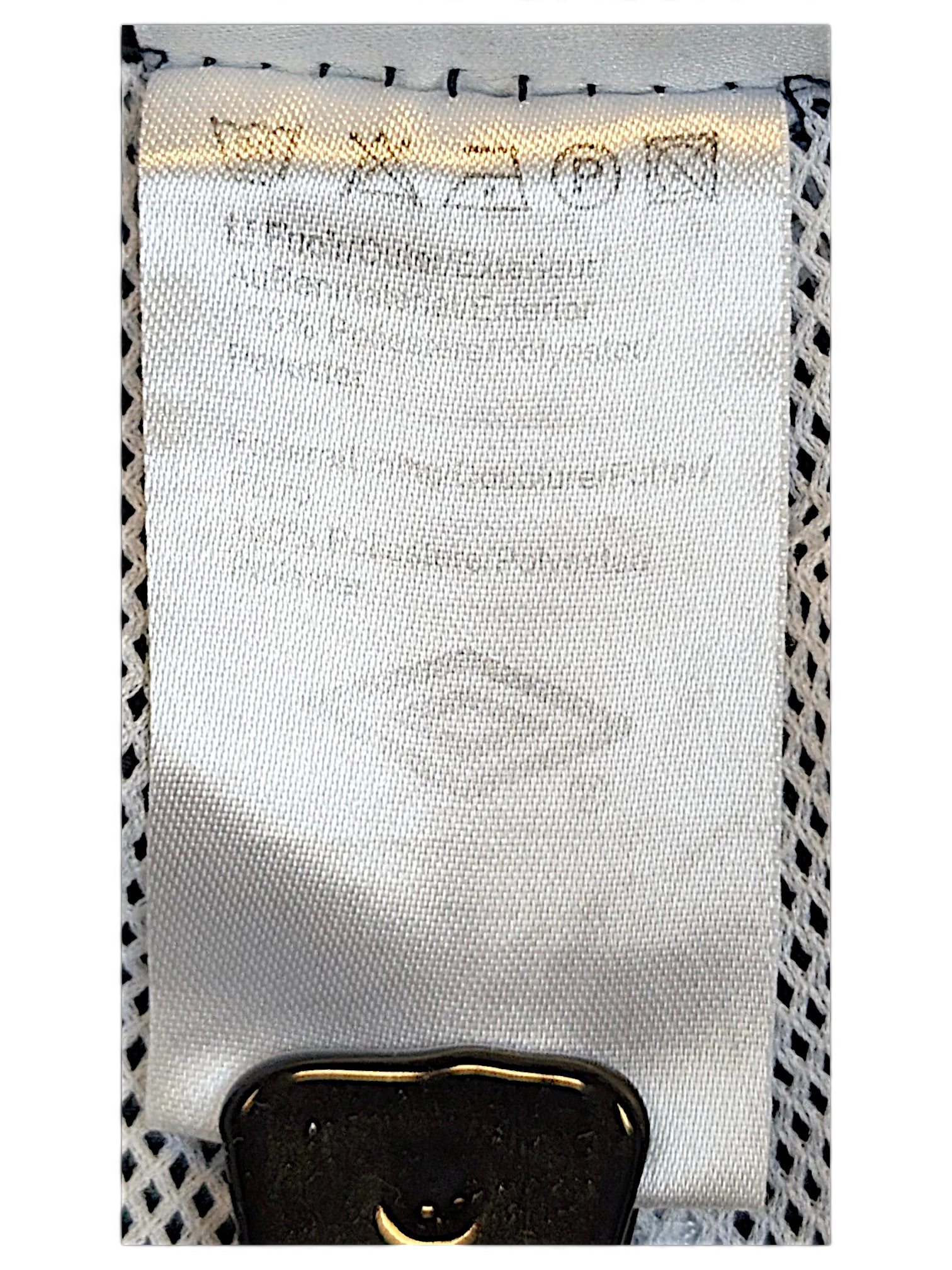 JAKE & IPI Umbro track pants care and material label showing washing instructions and polyester composition