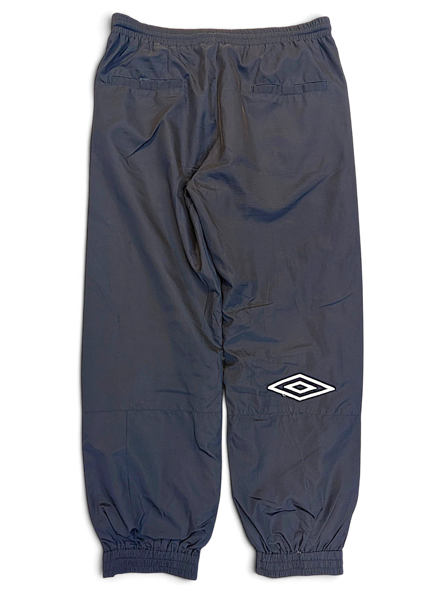 JAKE & IPI pre-owned Umbro navy track pants with elasticated cuffs and white logo detail on the leg