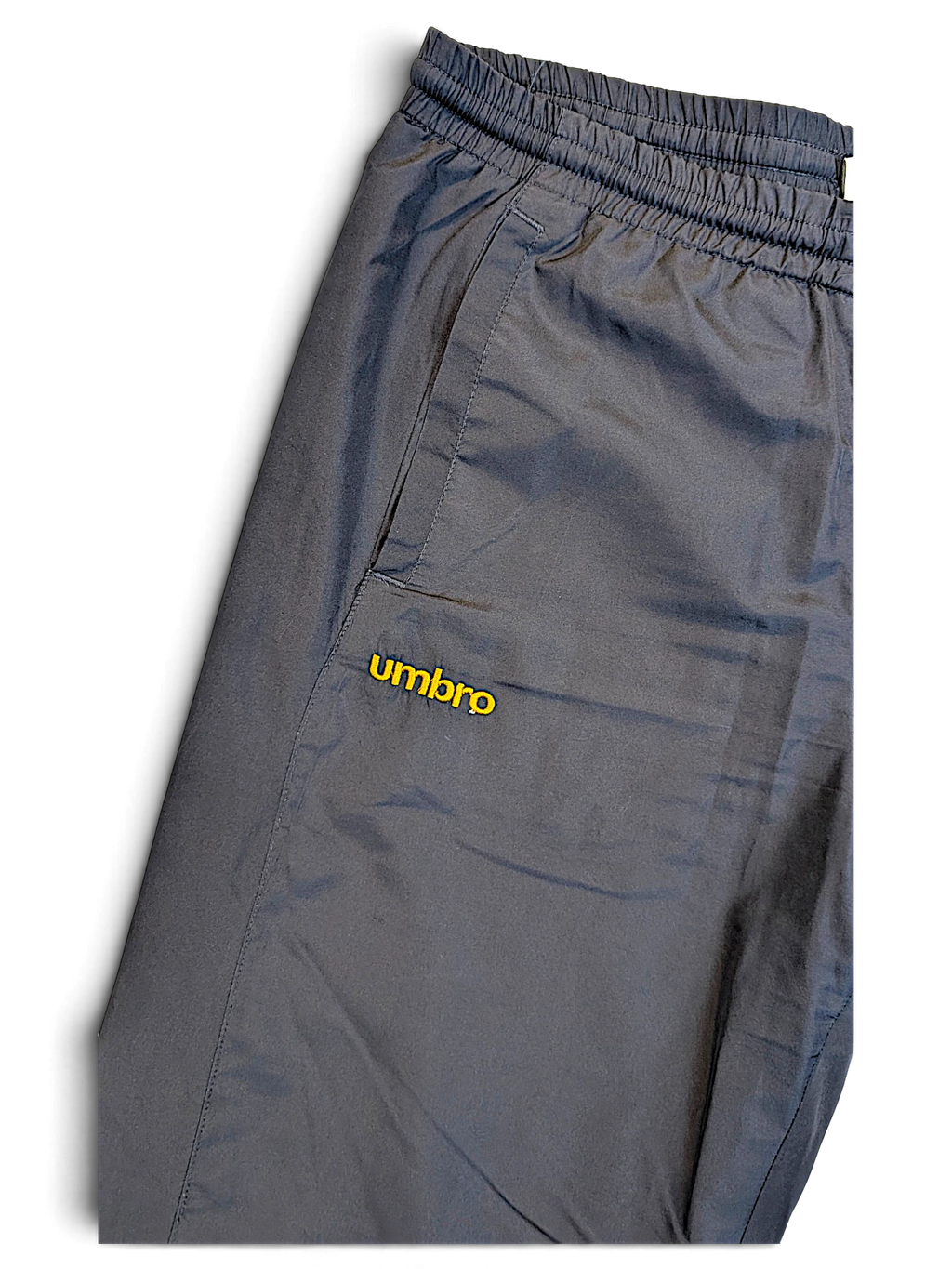 JAKE & IPI pre-owned navy Umbro track pants with an elasticated waistband and yellow embroidered logo detail.