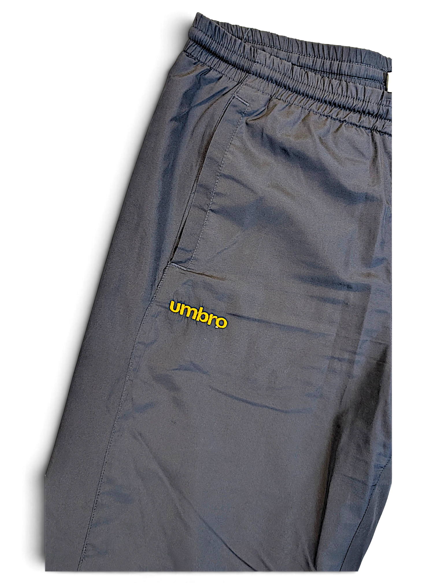 JAKE & IPI pre-owned navy Umbro track pants with an elasticated waistband and yellow embroidered logo detail.