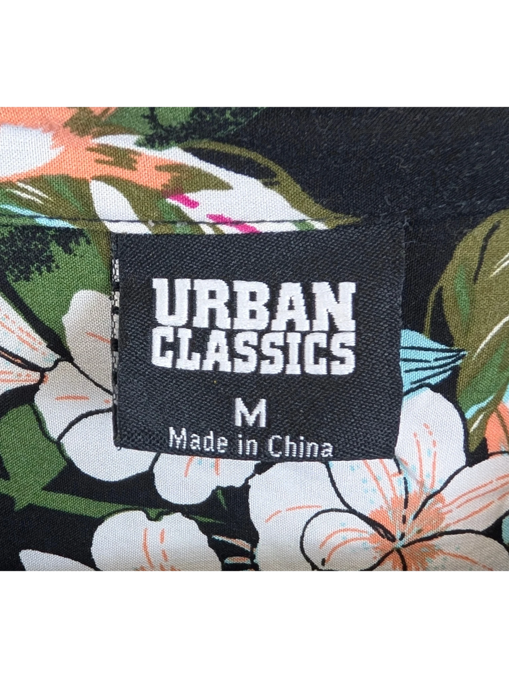 JAKE & IPI Urban Classics Hawaiian shirt featuring a black background with vibrant floral print and size M label