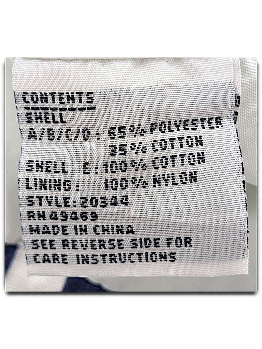 Lifestyles White Geometric Windbreaker – S; detail view showing fabric, construction, label or condition (image 4 of 5).