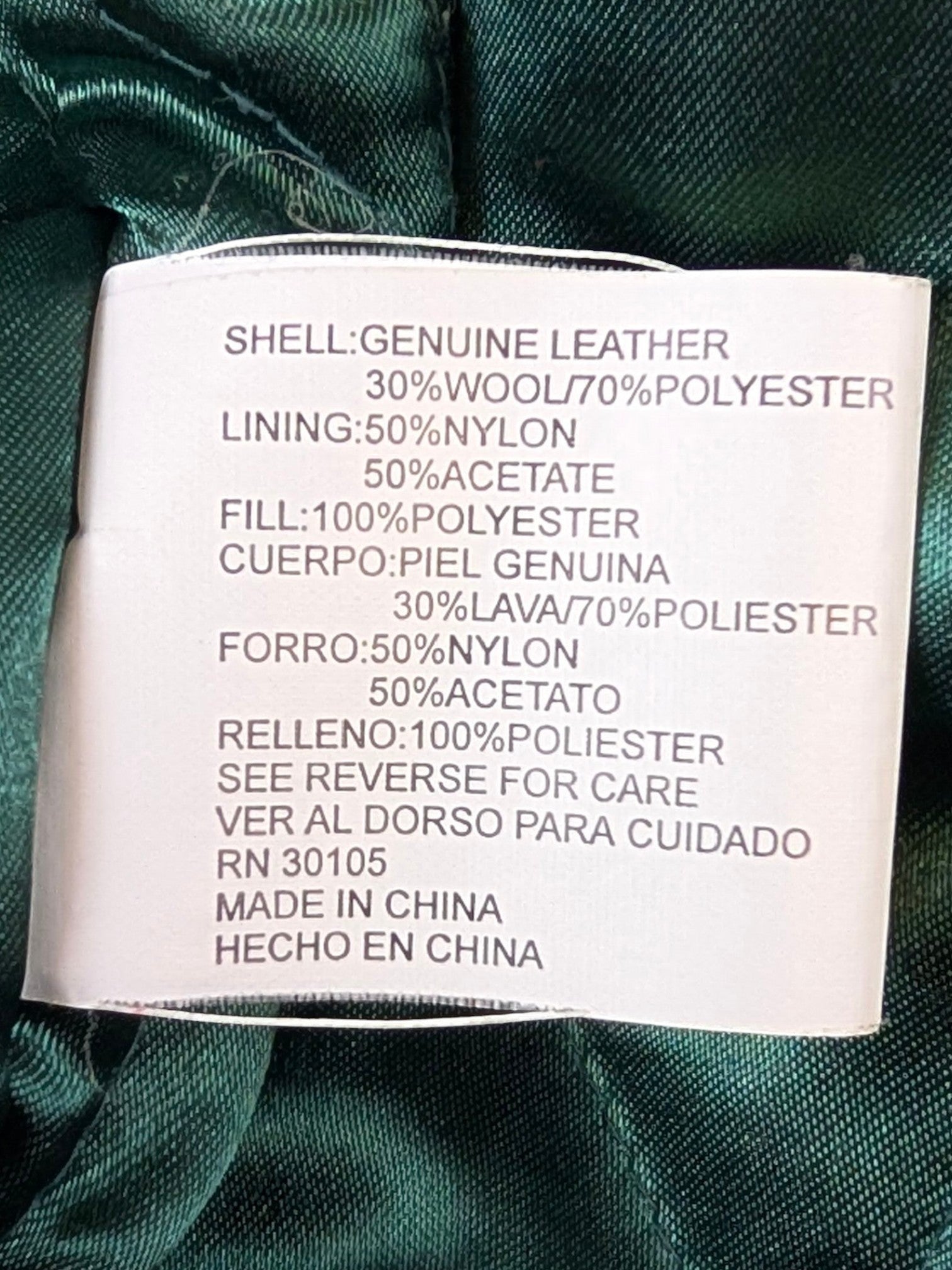 JAKE & IPI Jeff Hamilton varsity jacket material and care label showing genuine leather, wool, and polyester blend