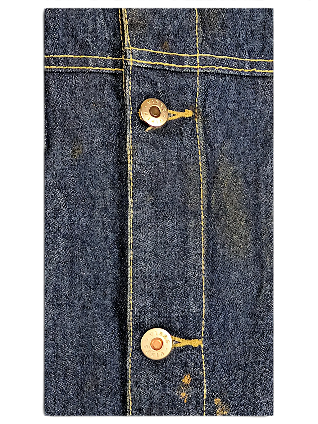 Close-up of JAKE & IPI Vibes denim vest featuring dark blue fabric, yellow contrast stitching, and branded metal buttons