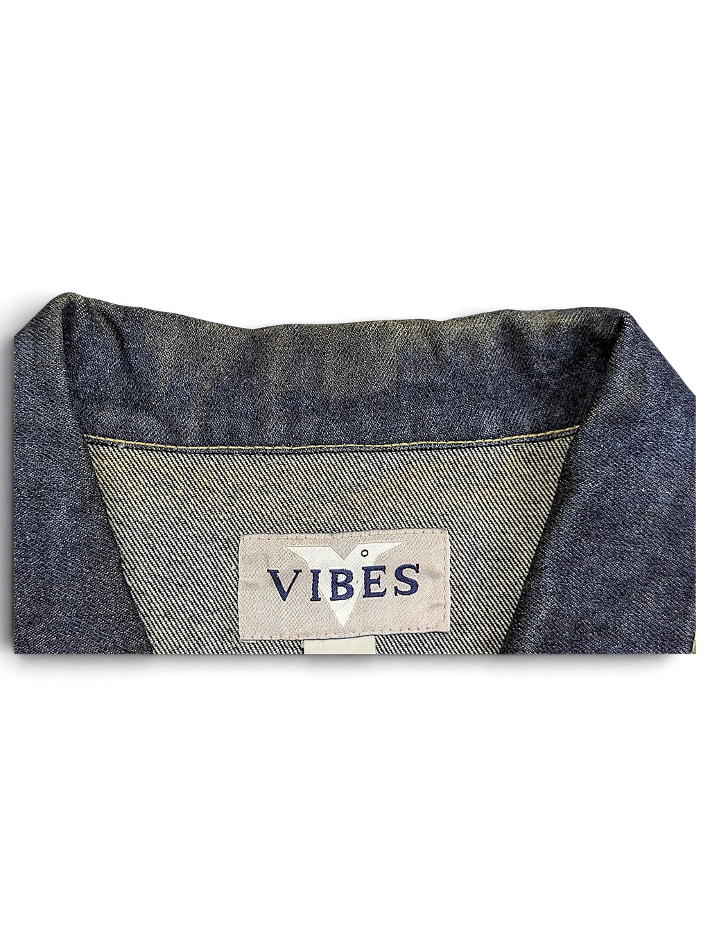JAKE & IPI Vibes denim vest featuring a classic blue denim collar and interior brand label