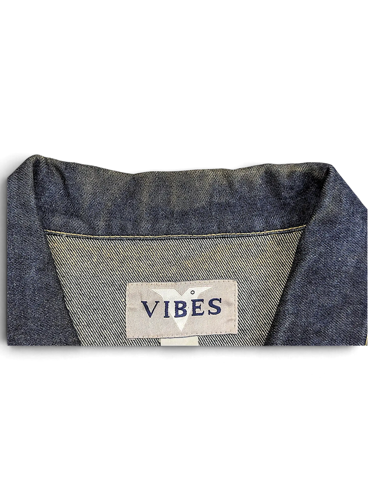 JAKE & IPI Vibes denim vest featuring a classic blue denim collar and interior brand label