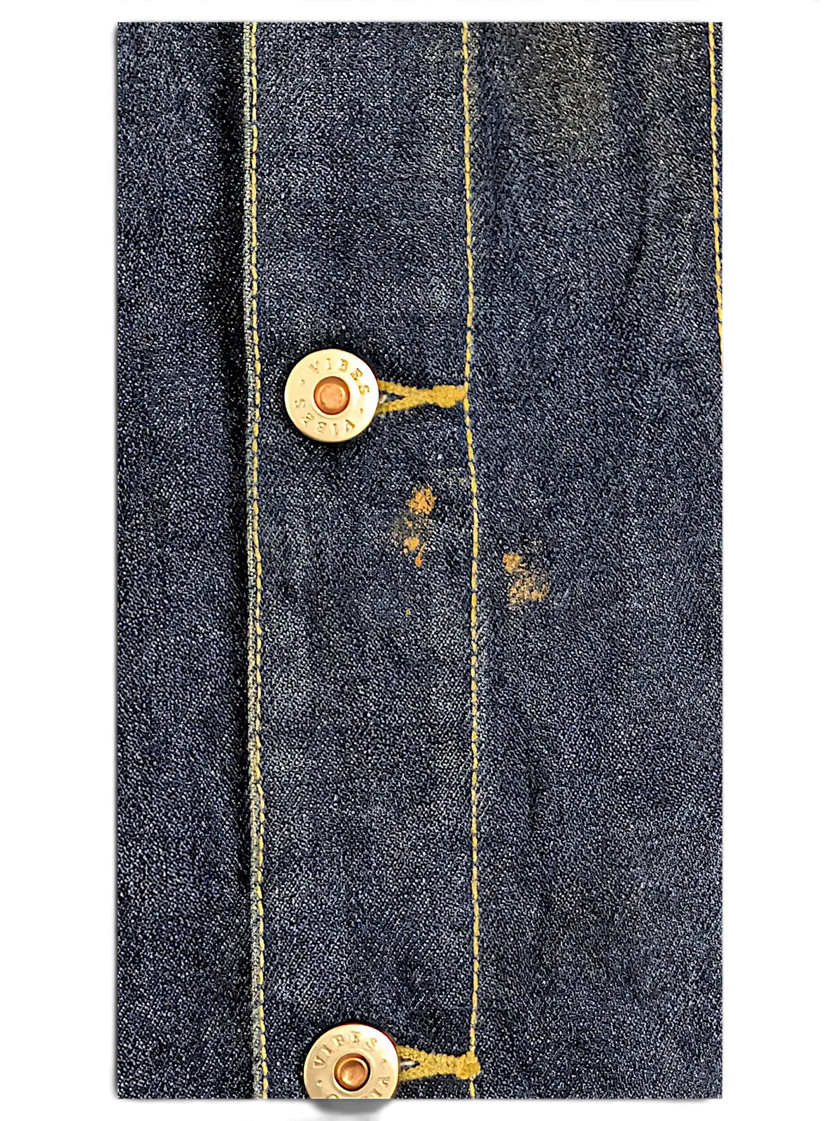 JAKE & IPI Vibes denim vest featuring dark blue fabric with yellow contrast stitching and branded metal buttons