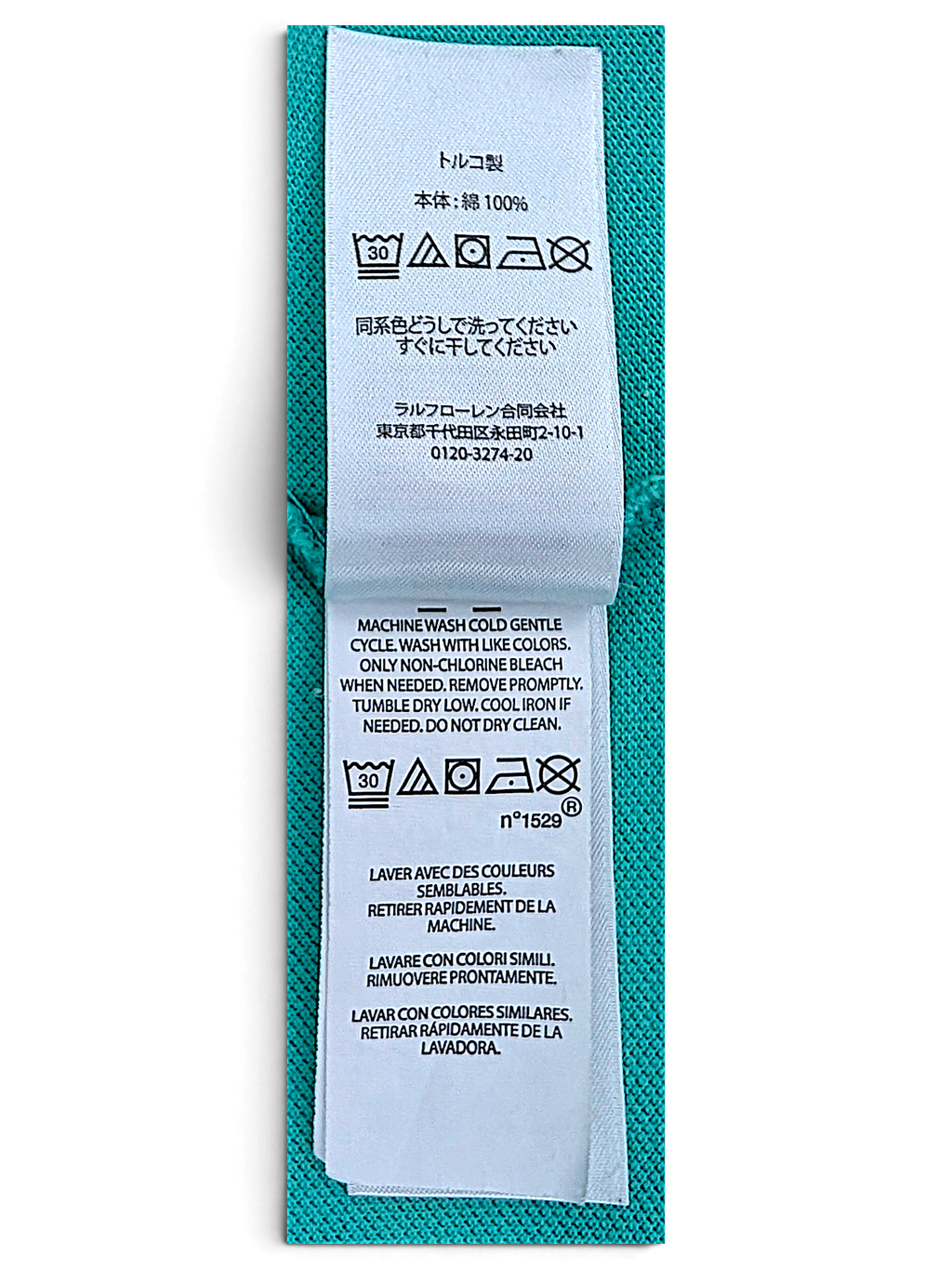 Green cotton fabric and care label on Polo Ralph Lauren polo shirt