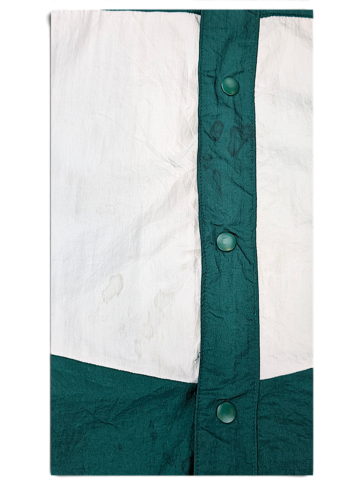 Edgar + Ash Green Colourblock Coach Jacket; Front panel and green snap detail.