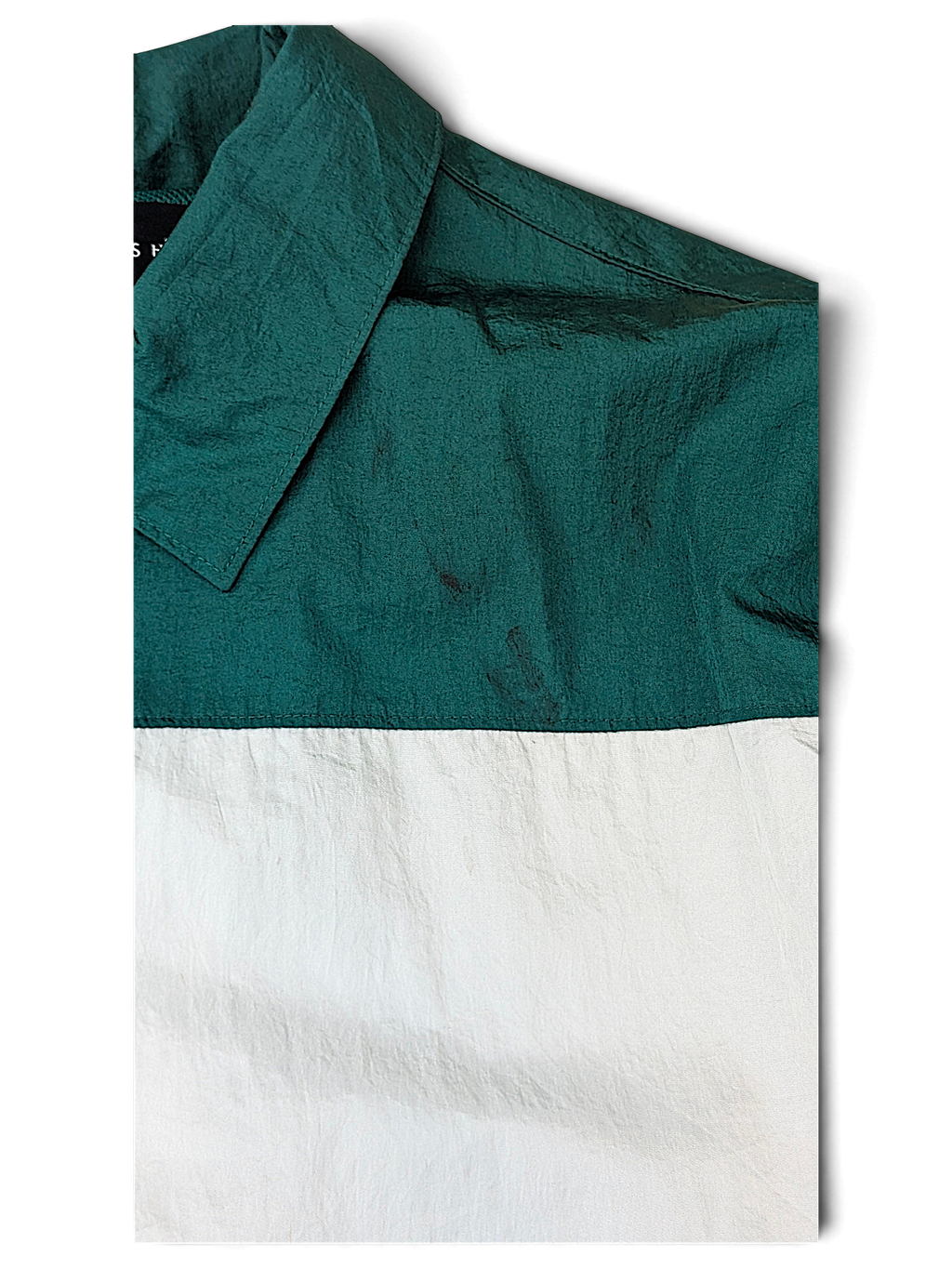 Edgar + Ash Green Colourblock Coach Jacket; Front fabric close-up showing minor marks.