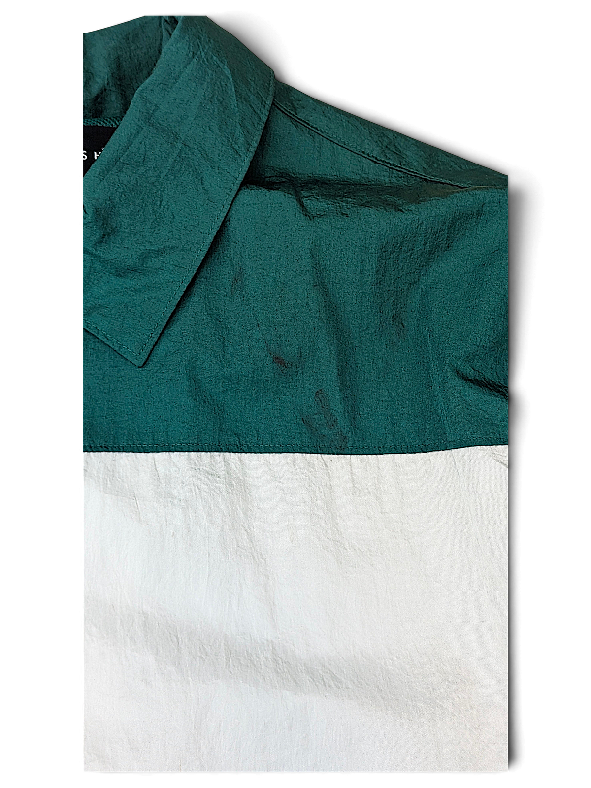 Edgar + Ash Green Colourblock Coach Jacket; Front fabric close-up showing minor marks.