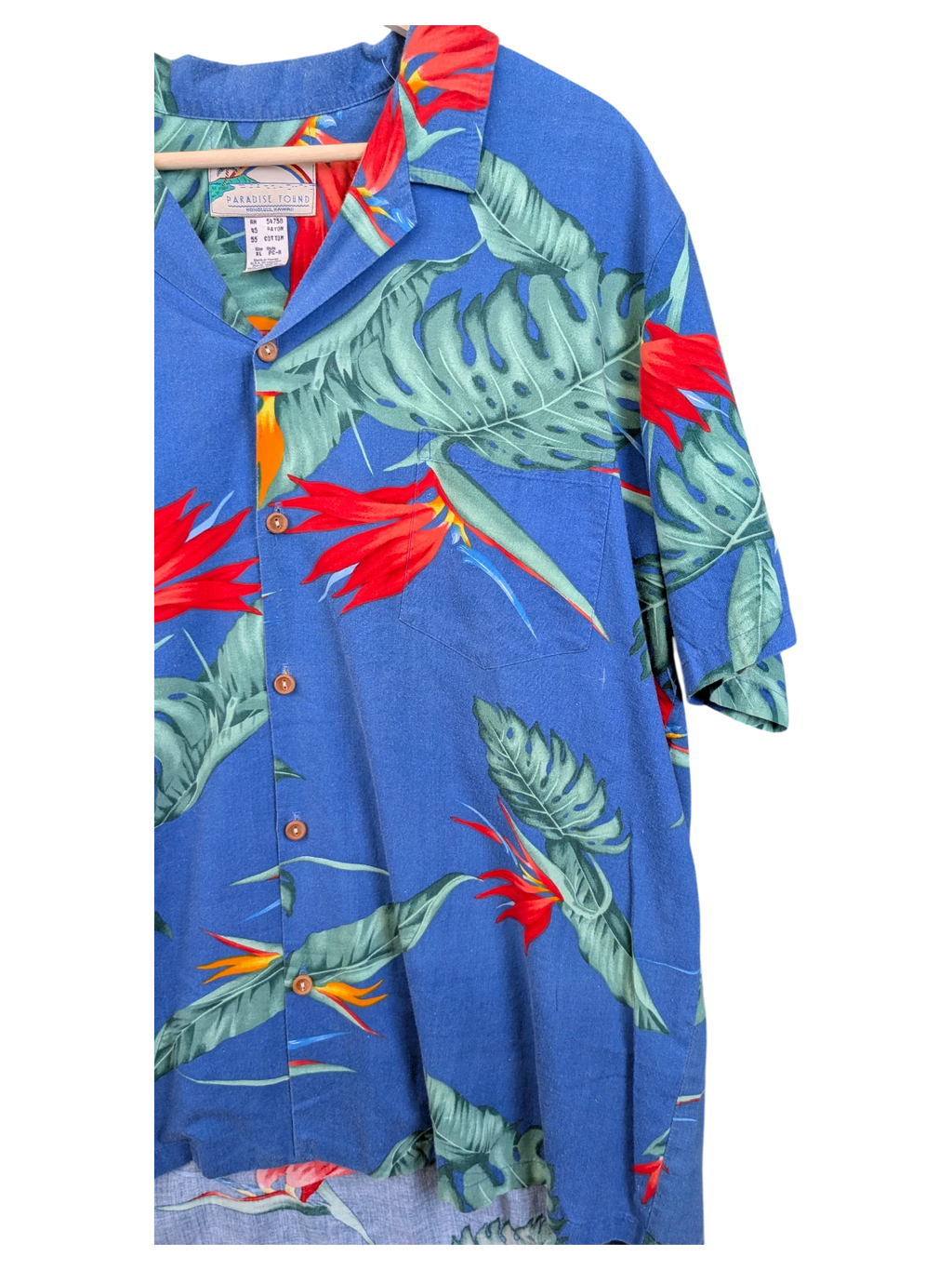 JAKE & IPI vintage blue Hawaiian shirt featuring a tropical bird of paradise and monstera leaf print with button front.
