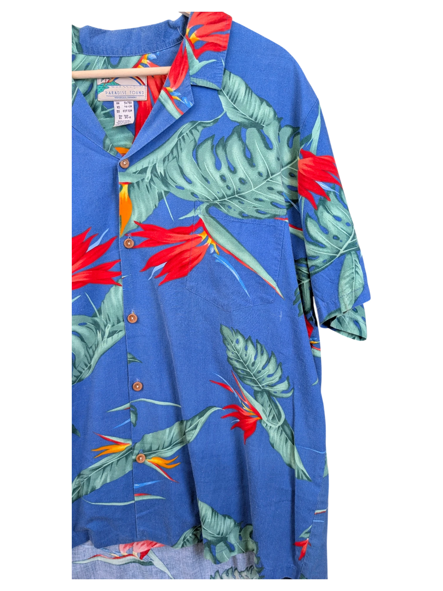 JAKE & IPI vintage blue Hawaiian shirt featuring a tropical bird of paradise and monstera leaf print with button front.
