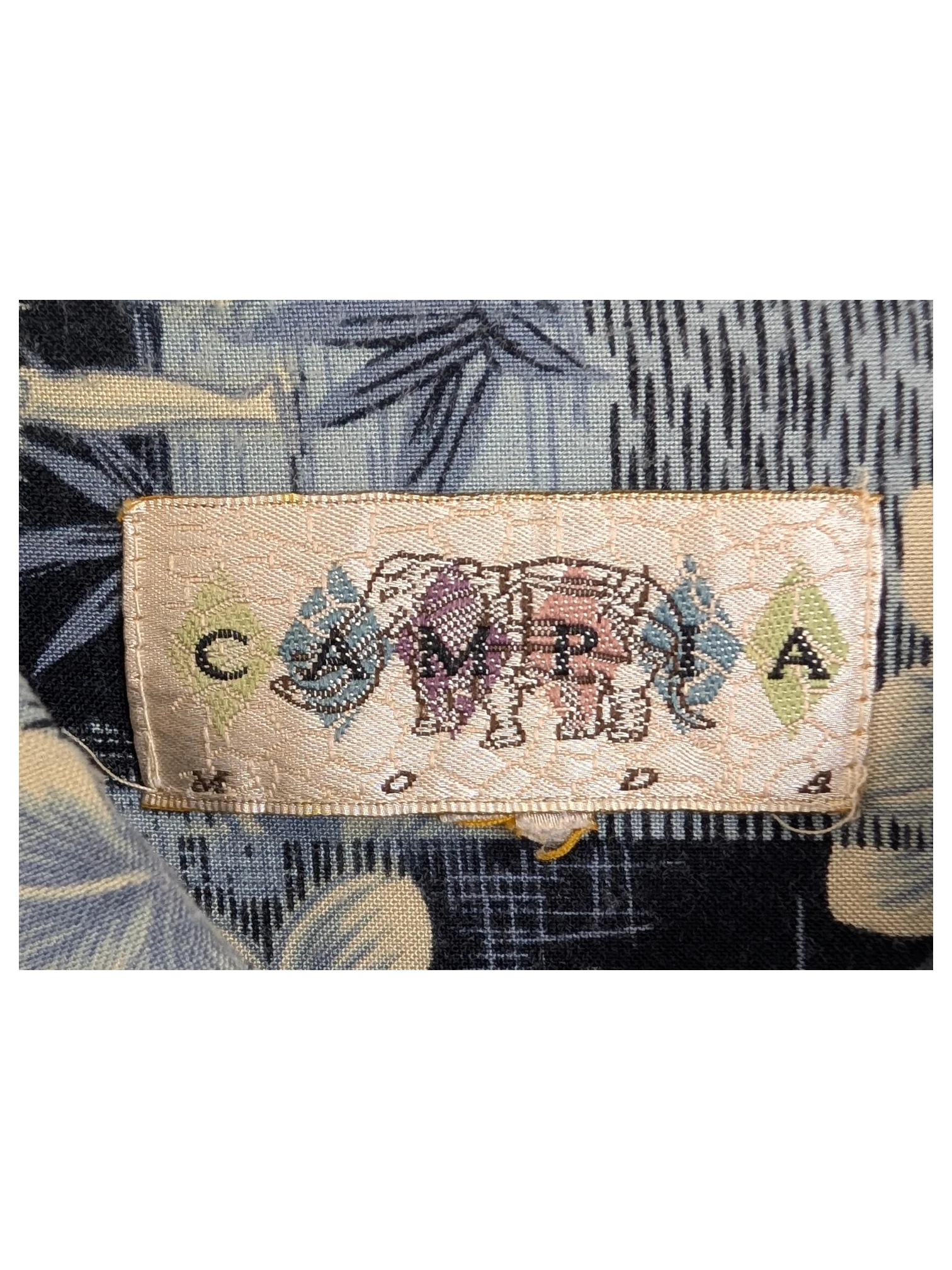 JAKE & IPI vintage Campia Hawaiian shirt label with blue floral print and 100% rayon fabric tag