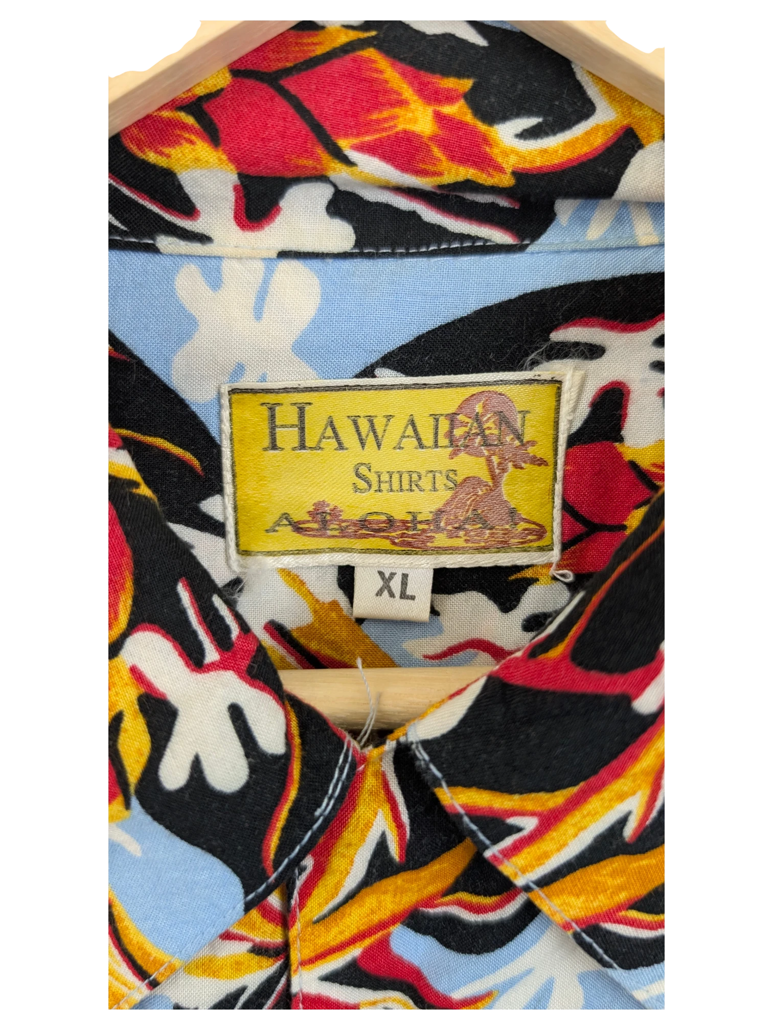 JAKE & IPI vintage 90s Hawaiian shirt with a vibrant floral pattern in red, yellow, and black on a light blue background