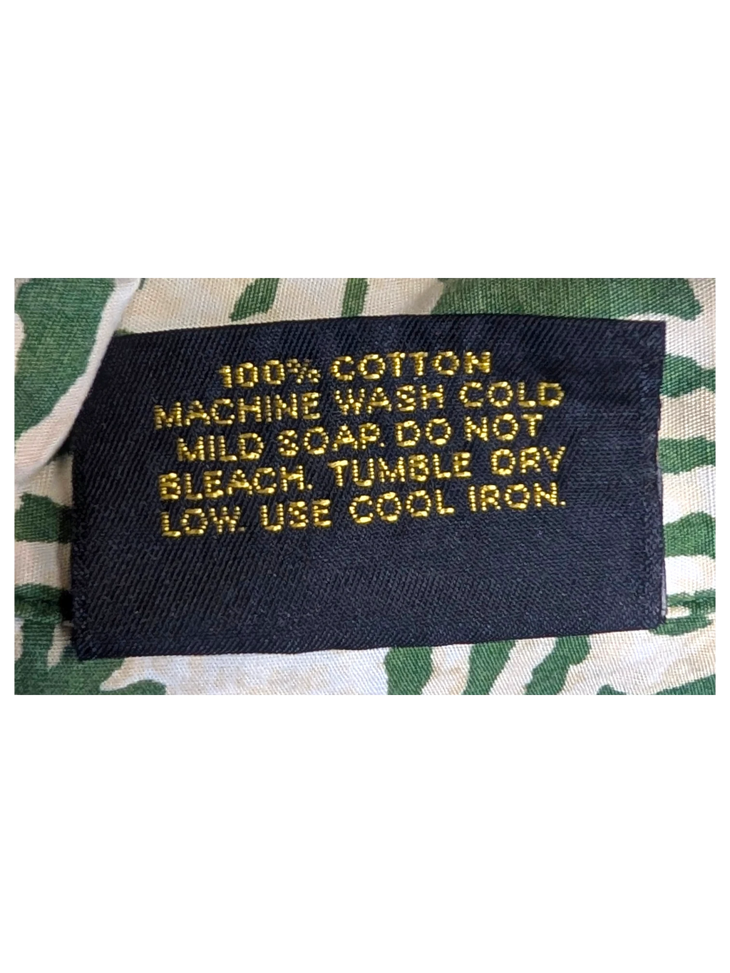 JAKE & IPI vintage Hawaiian shirt care label showing 100% cotton material and washing instructions