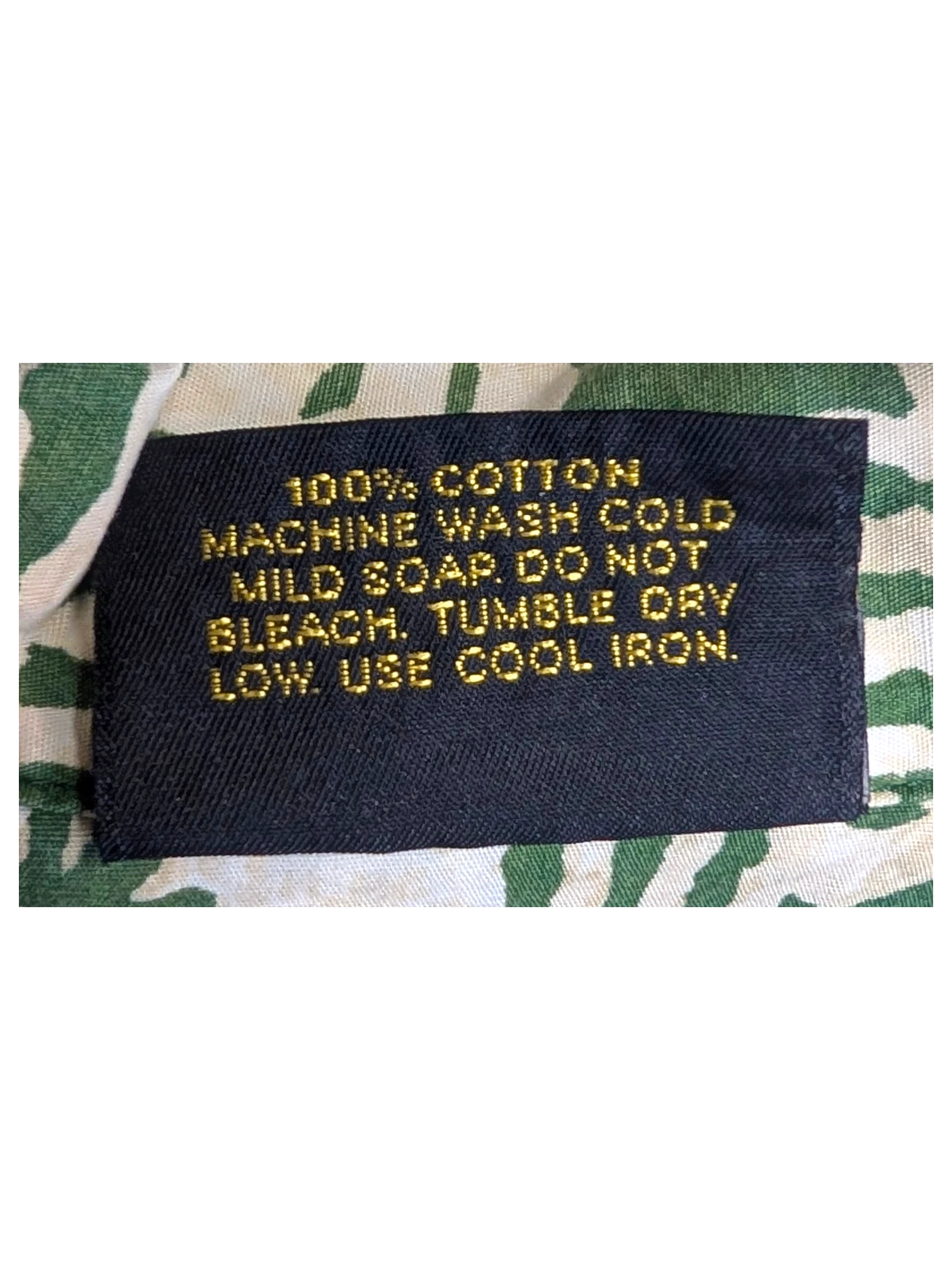 JAKE & IPI vintage Hawaiian shirt care label showing 100% cotton material and washing instructions