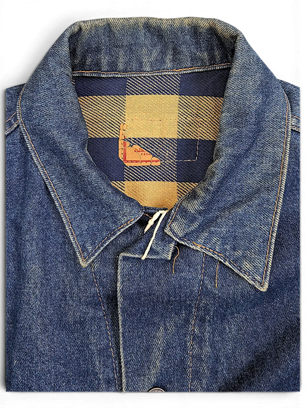 JAKE & IPI vintage Levi's denim jacket featuring a blue and tan plaid flannel collar lining and classic denim texture