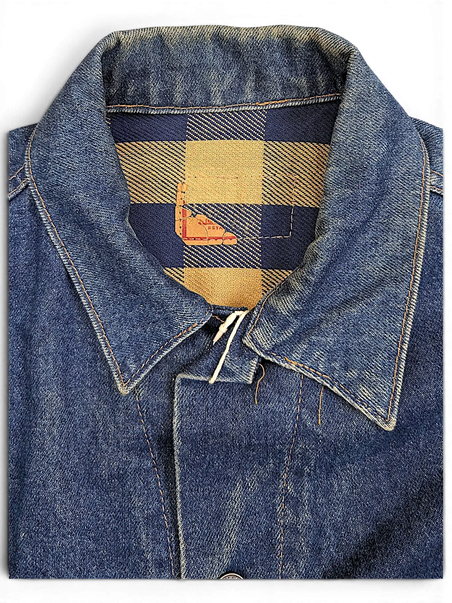 JAKE & IPI vintage Levi's denim jacket featuring a blue and tan plaid flannel collar lining and classic denim texture