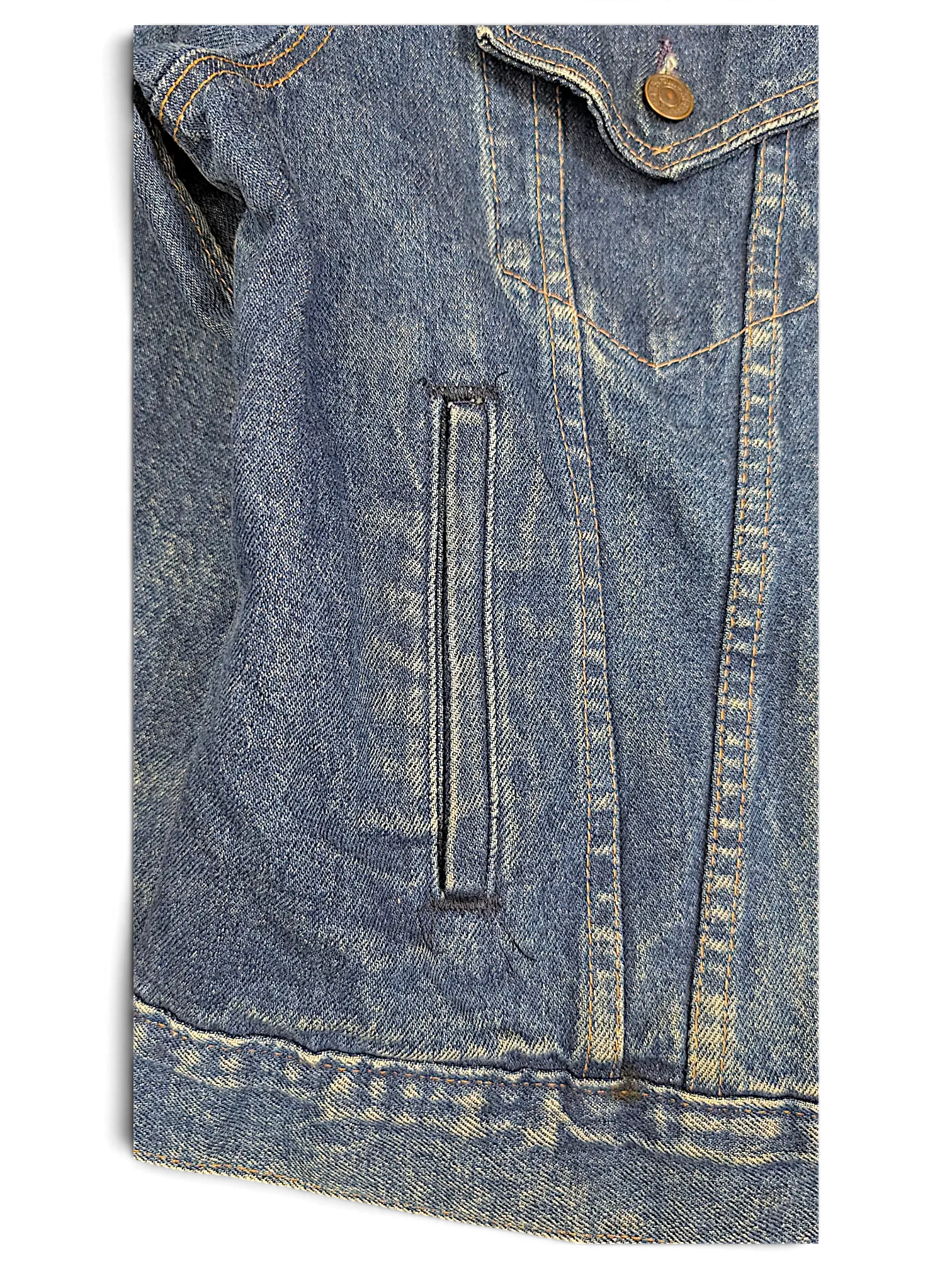 Close-up of a vintage JAKE & IPI Levi's denim jacket featuring blue wash fabric, contrast stitching, and a side pocket.