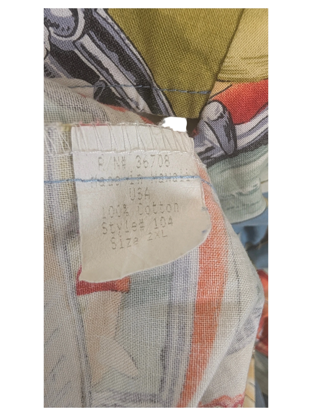 JAKE & IPI vintage RJC Hawaiian shirt tag showing 100% cotton material and size 2XL made in Hawaii
