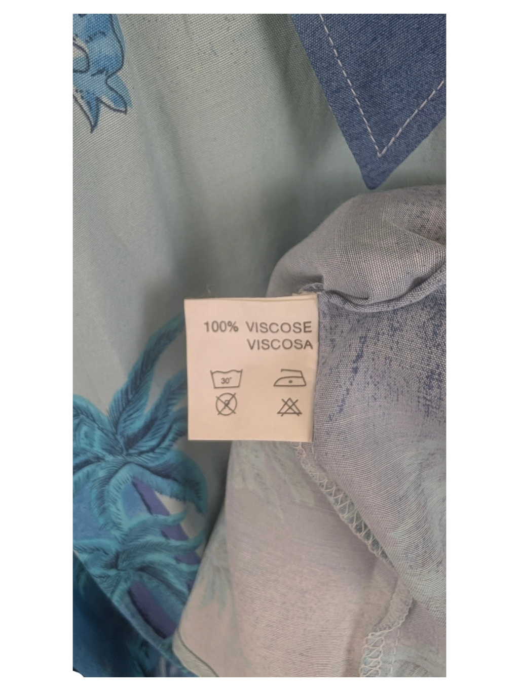 JAKE & IPI Destination Liberté Hawaiian shirt care label showing 100% viscose material and laundry instructions