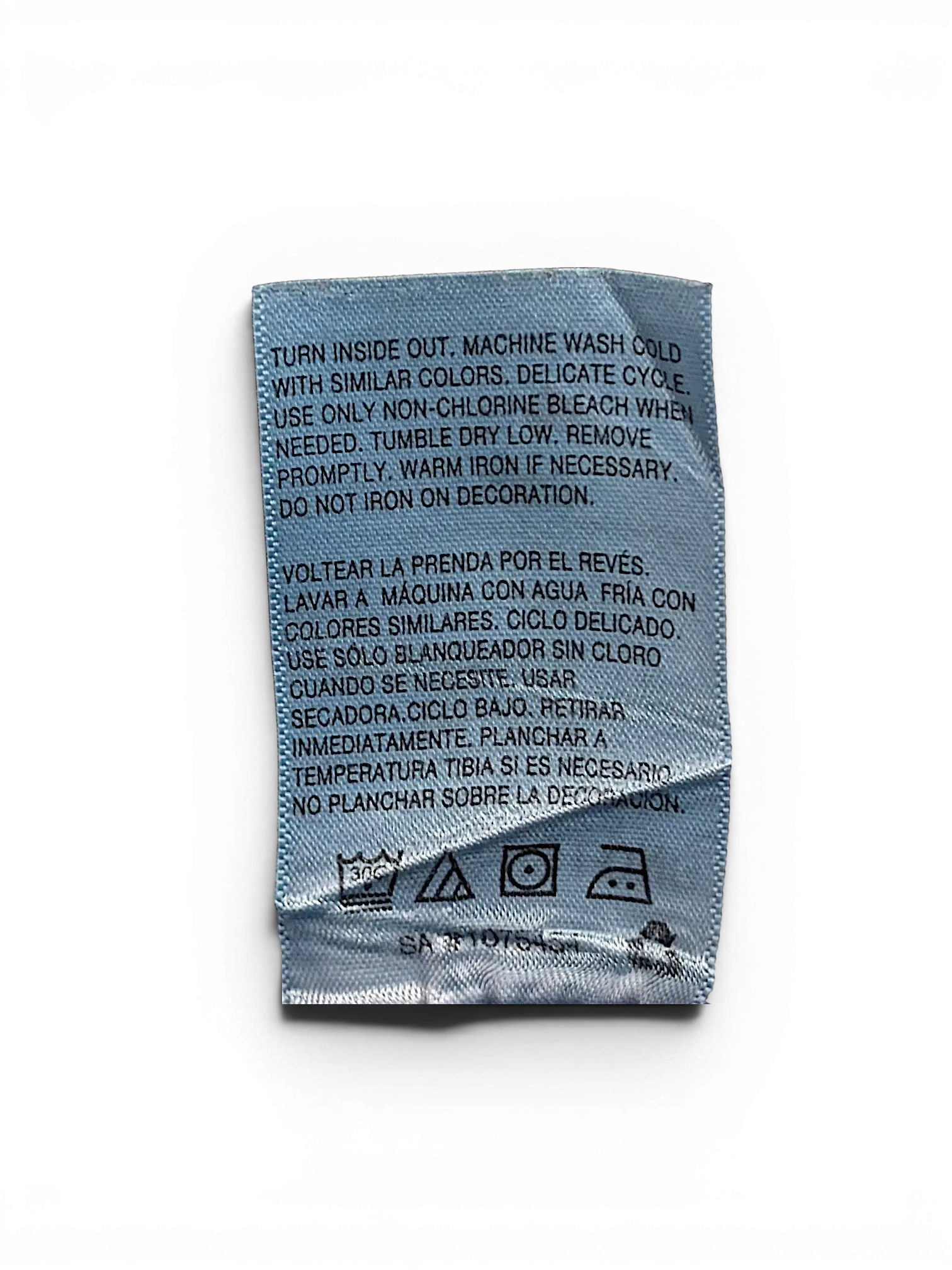 JAKE & IPI Wallflower Plus Long 20 garment care label with washing instructions in English and Spanish