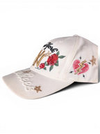 JAKE & IPI white baseball cap featuring embroidered New York text, red roses, a heart, and gold star details.