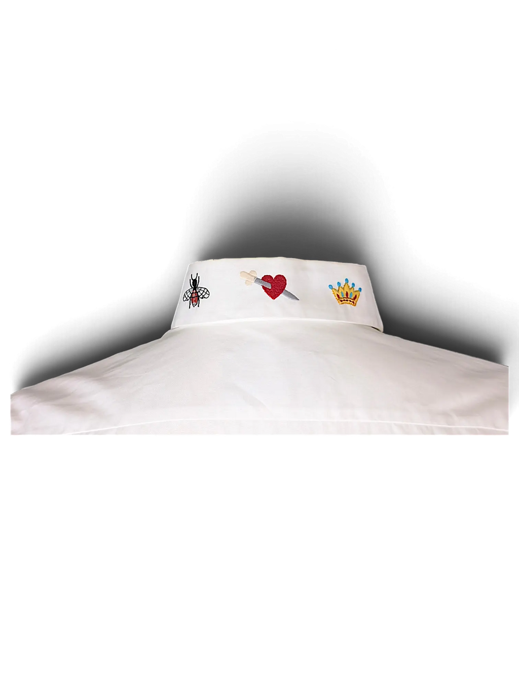 JAKE & IPI white cotton shirt featuring embroidered bee, heart with dagger, and crown icons on the collar.
