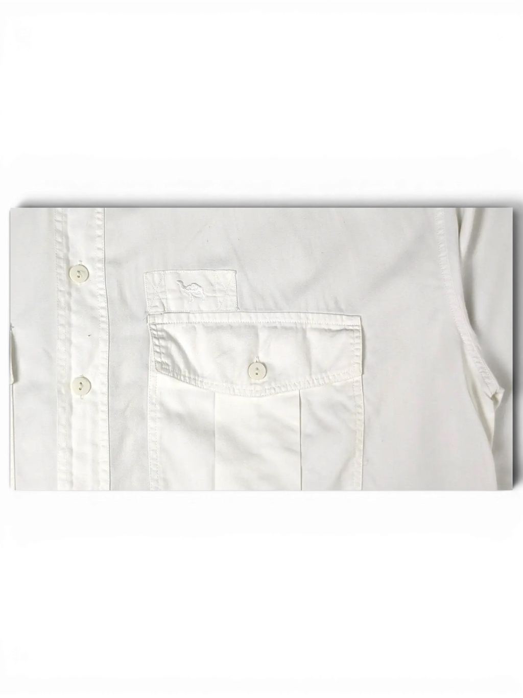 JAKE & IPI white short sleeve utility shirt featuring a button-down collar and a chest pocket with camel embroidery.