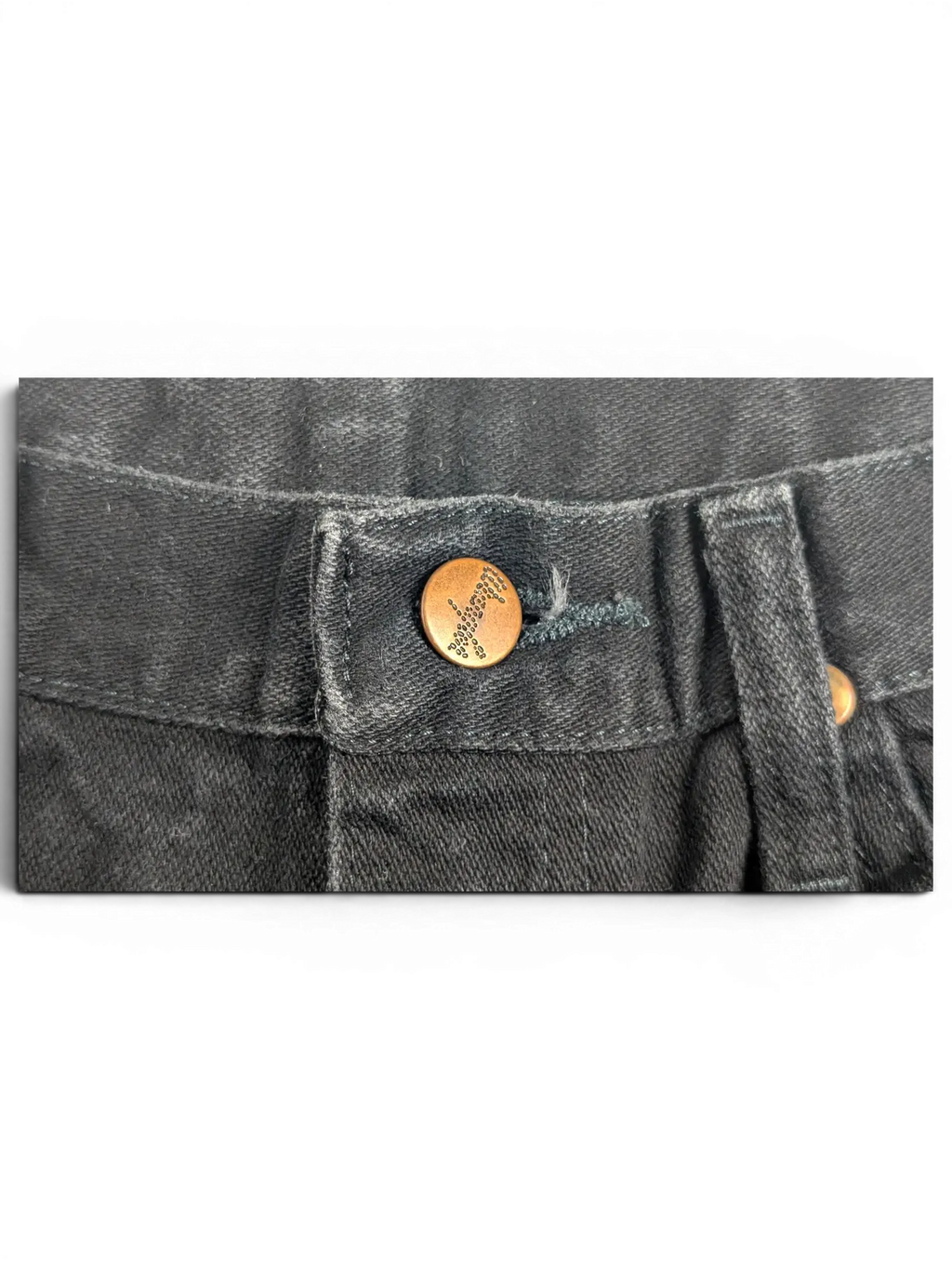 JAKE & IPI Wrangler A203 black denim jeans featuring a branded copper button closure at the waist.