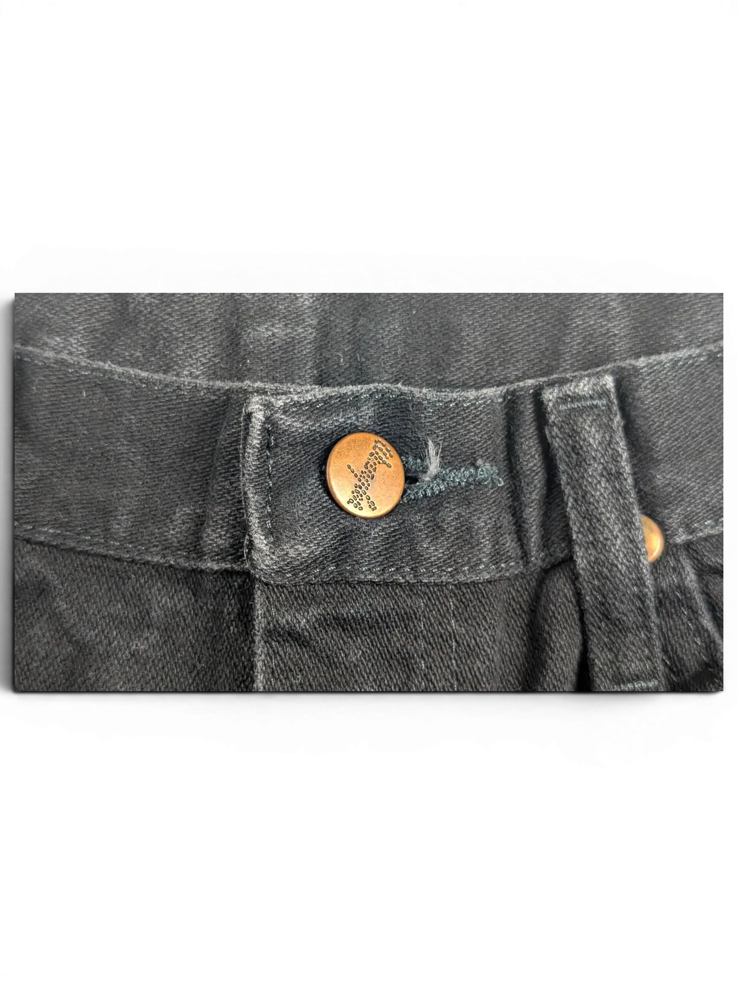 JAKE & IPI Wrangler A203 black denim jeans featuring a branded copper button closure at the waist.