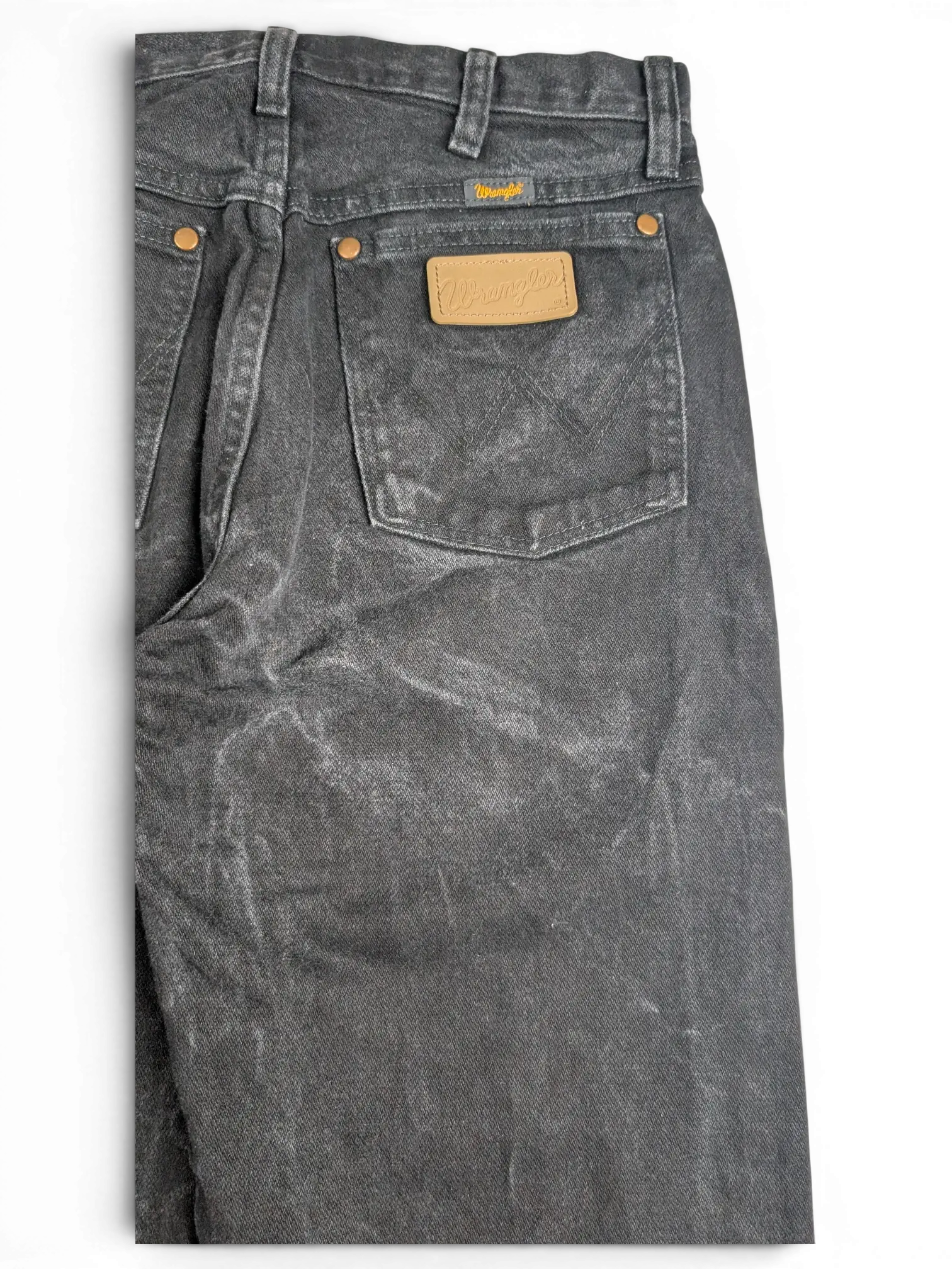JAKE & IPI Wrangler A203 black denim jeans featuring a tan leather back patch and copper rivets