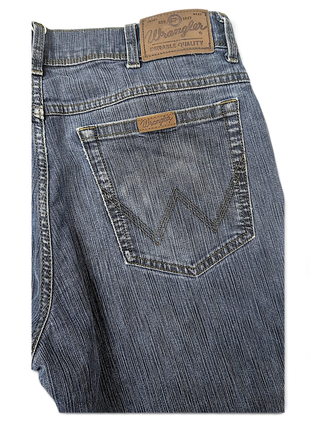 JAKE & IPI Wrangler blue denim jeans featuring a classic five-pocket design and leather brand patch on the back.