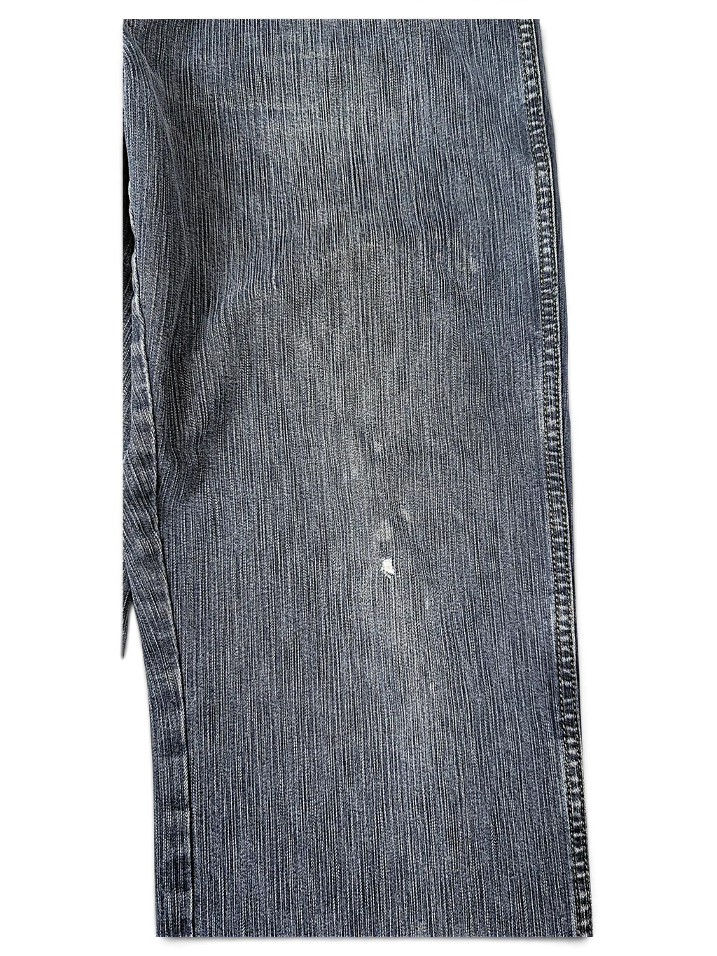 JAKE & IPI Wrangler blue denim jeans featuring a classic five-pocket design and subtle distressed wear detail.