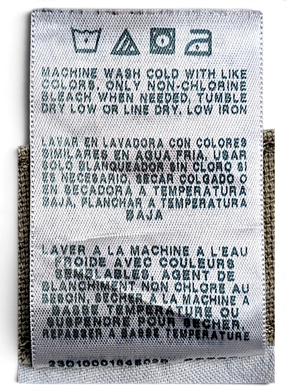 JAKE & IPI Wrangler carpenter pants care label with washing instructions in English, Spanish, and French.