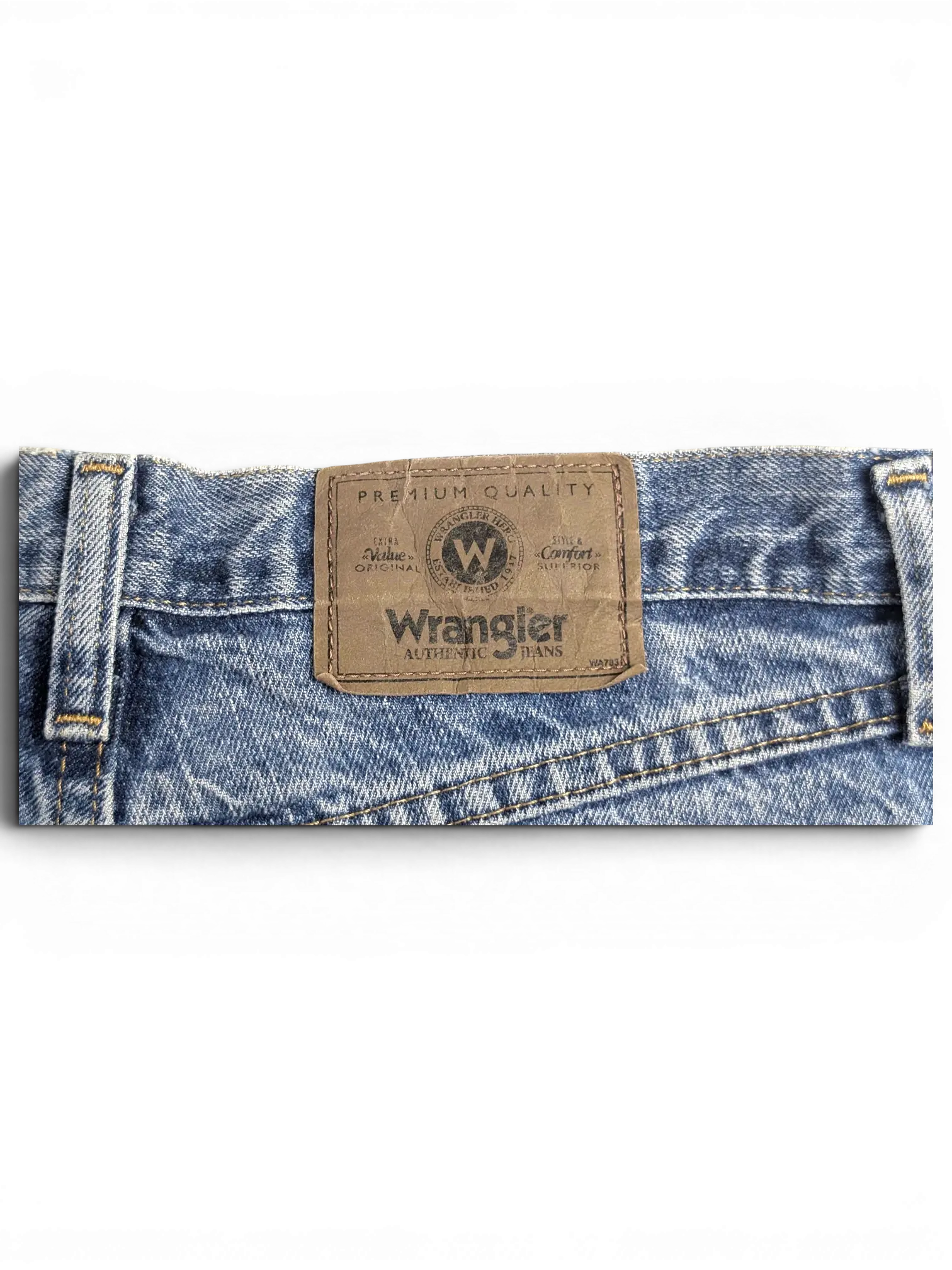 JAKE & IPI Wrangler blue denim jeans featuring a brown leather brand patch on the back waistband