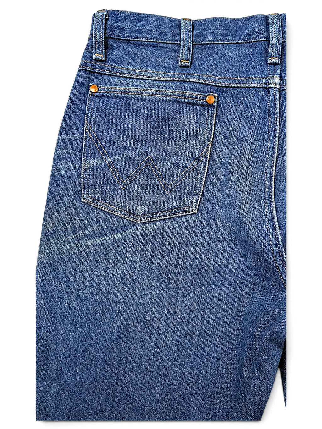 JAKE & IPI Wrangler 936PWD blue denim jeans featuring iconic W stitching on the back pocket and copper rivets.