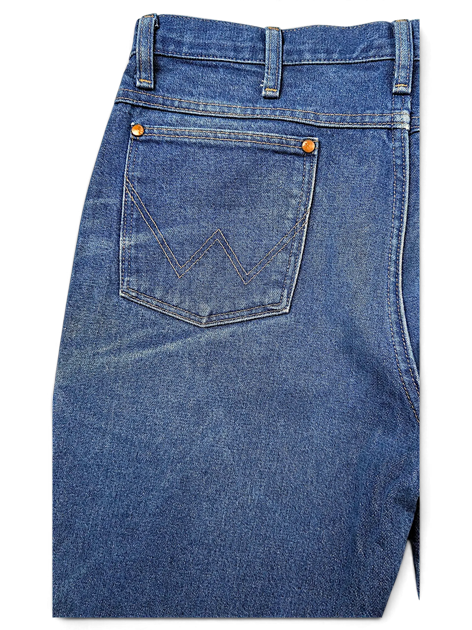 JAKE & IPI Wrangler 936PWD blue denim jeans featuring iconic W stitching on the back pocket and copper rivets.
