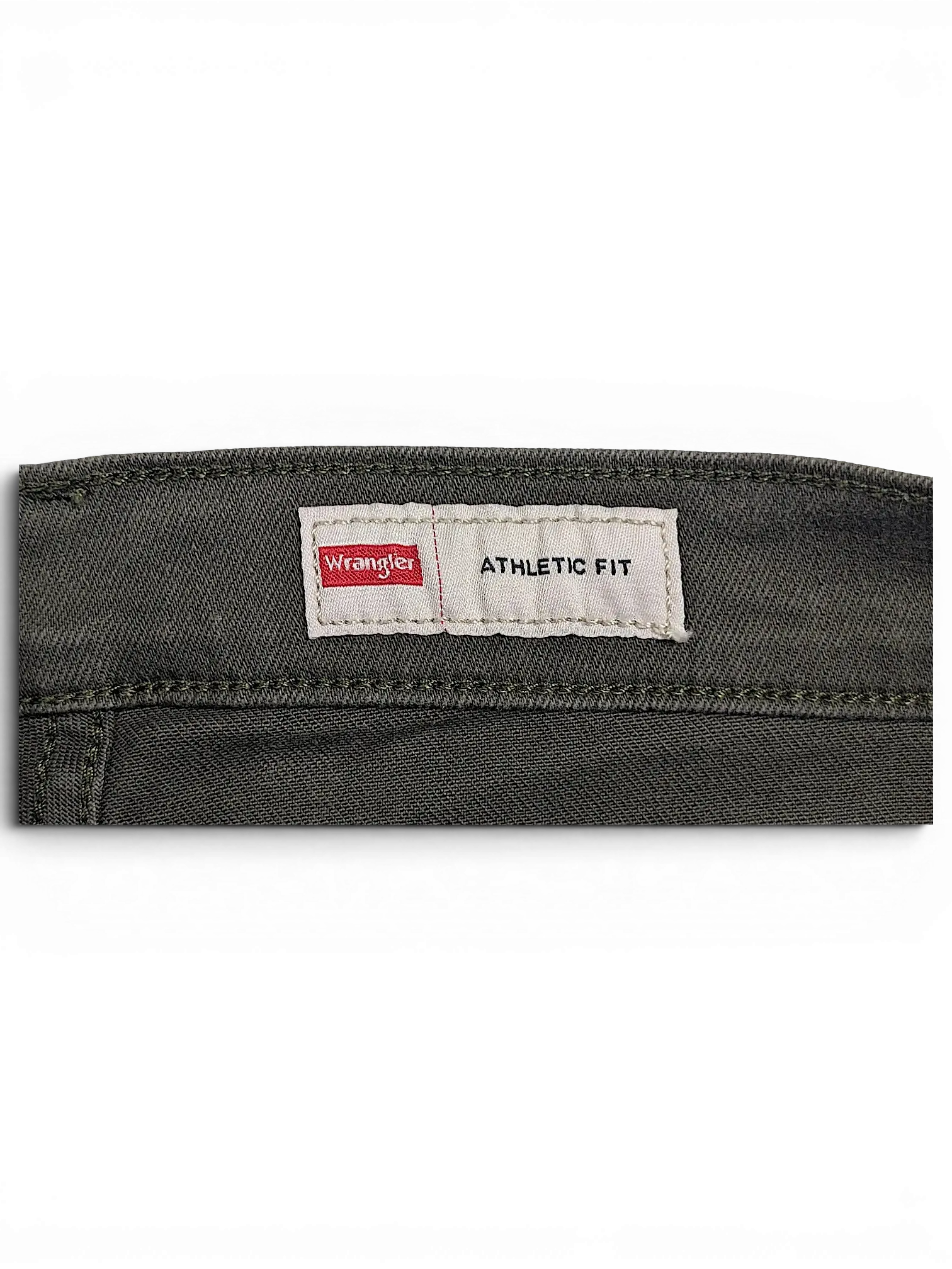 JAKE & IPI Wrangler green athletic fit jeans featuring a branded back waistband label on olive denim fabric.