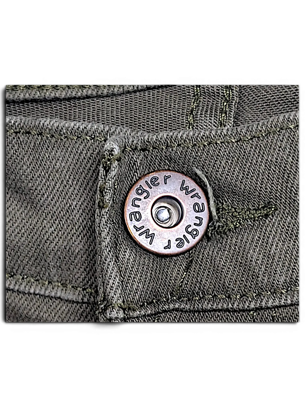 Close-up of JAKE & IPI Wrangler green athletic fit jeans featuring a branded metal button and sturdy denim stitching.