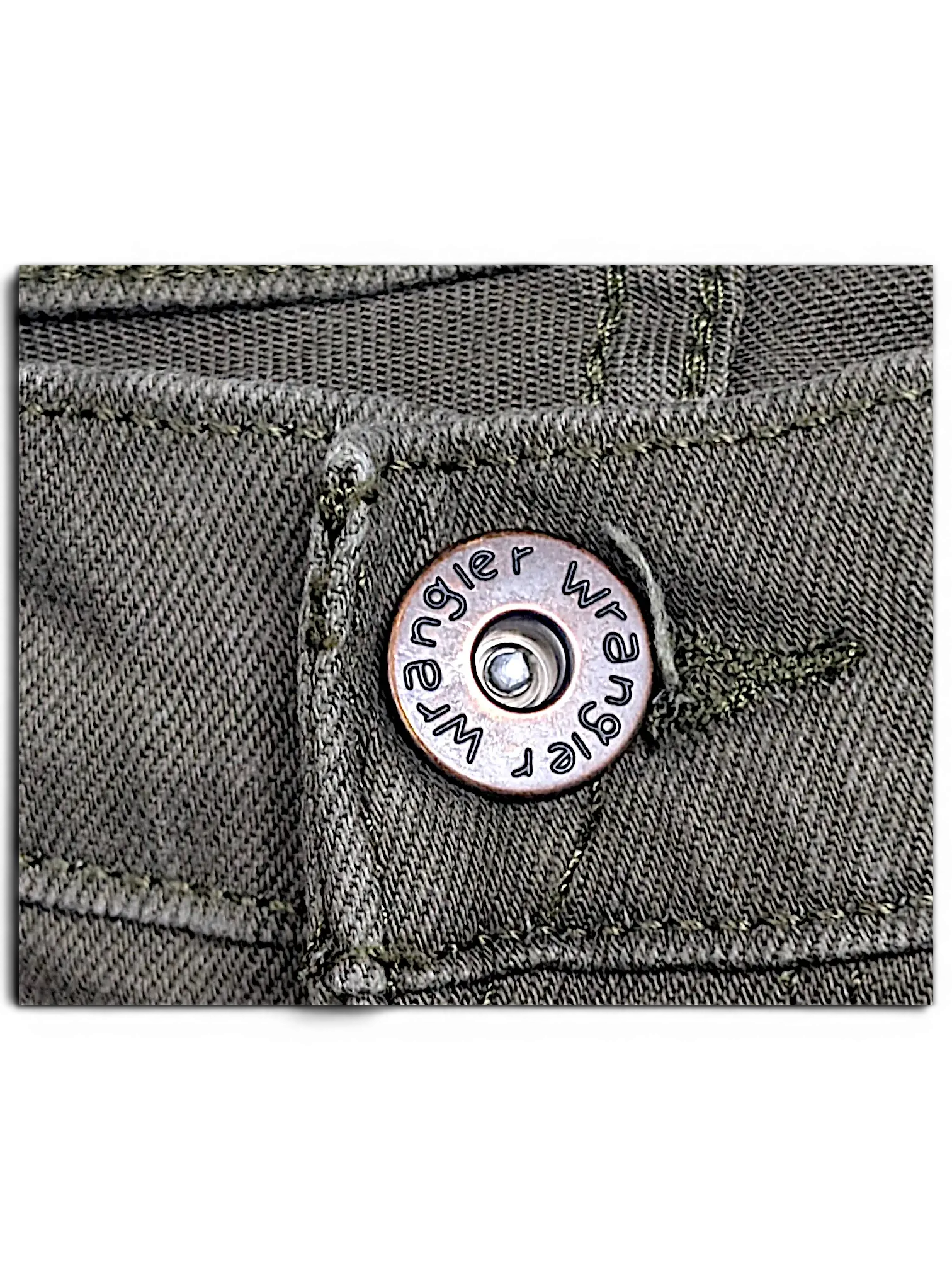 Close-up of JAKE & IPI Wrangler green athletic fit jeans featuring a branded metal button and sturdy denim stitching.