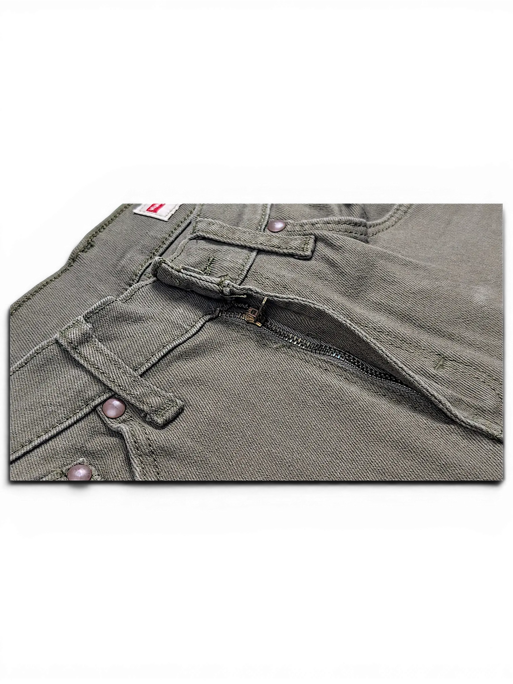 Close-up of JAKE & IPI Wrangler green athletic fit jeans featuring a metal zipper fly and reinforced stitching.