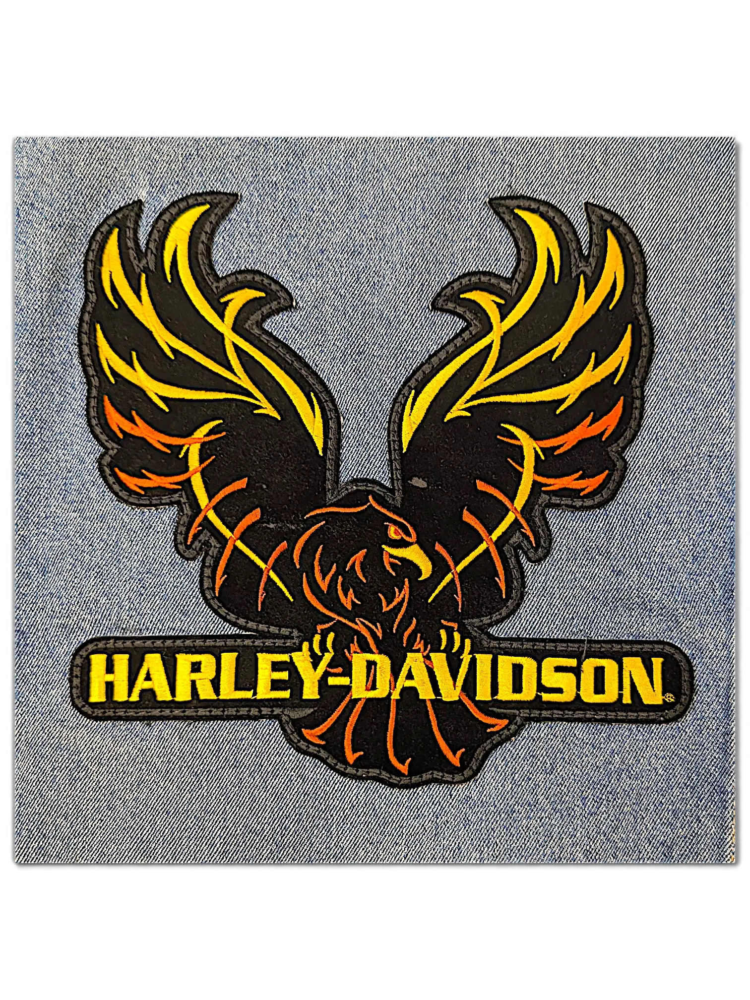 JAKE & IPI Wrangler denim jacket featuring a detailed orange and yellow embroidered Harley-Davidson eagle logo