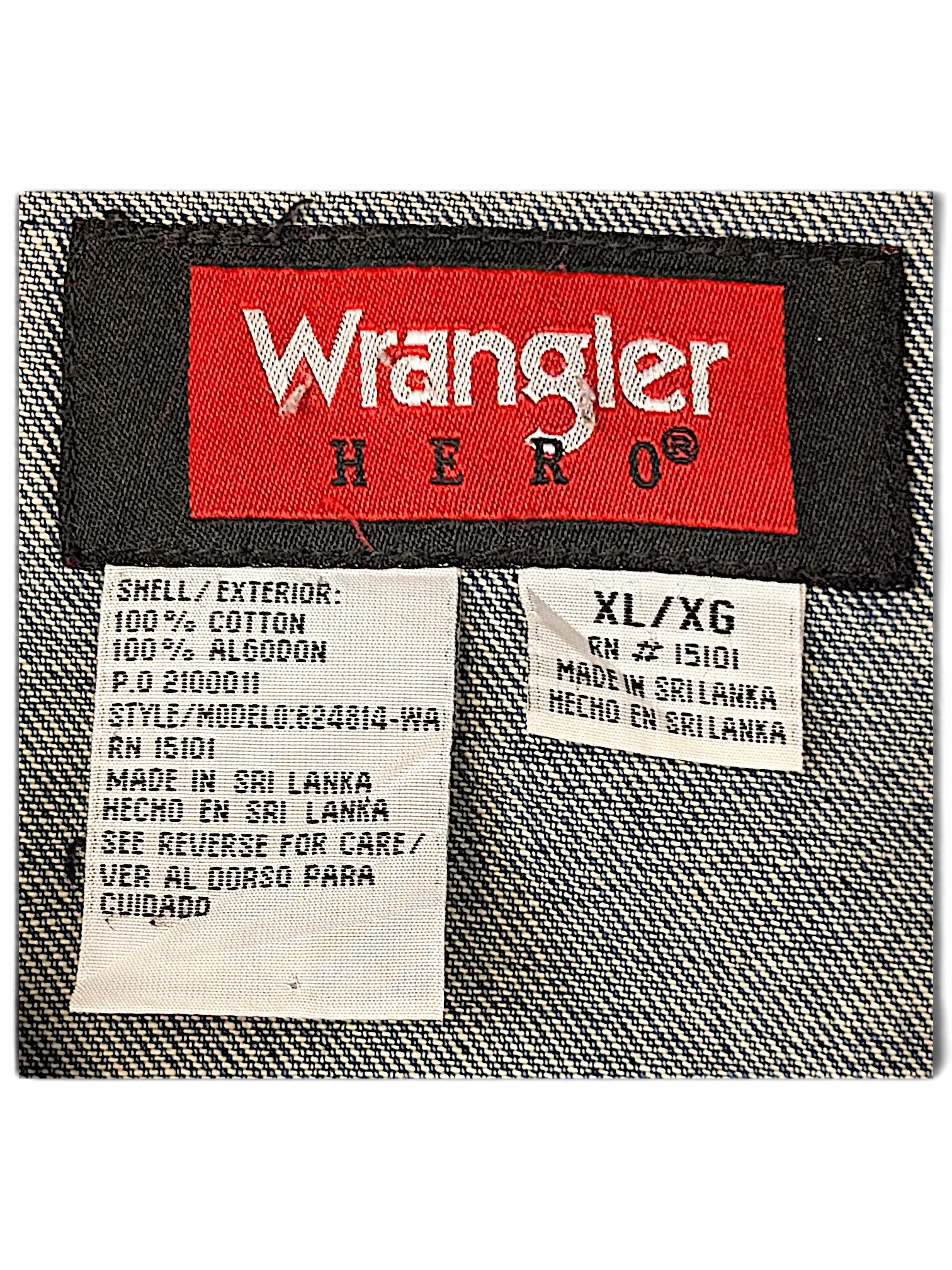 JAKE & IPI Wrangler Hero denim jacket interior label showing 100 percent cotton material and size XL