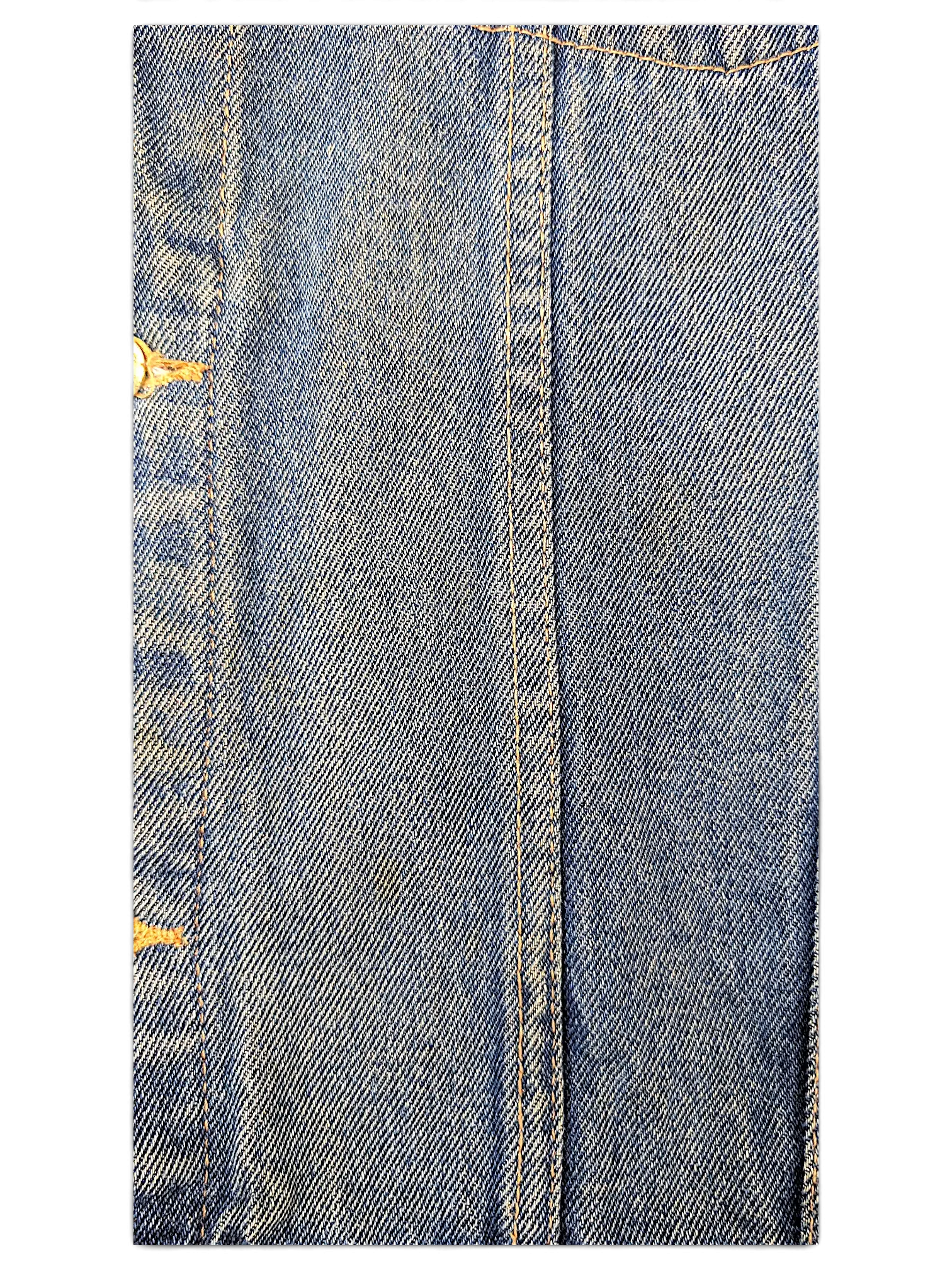 Close-up of JAKE & IPI Wrangler Hero denim jacket showing blue cotton fabric texture and orange contrast stitching