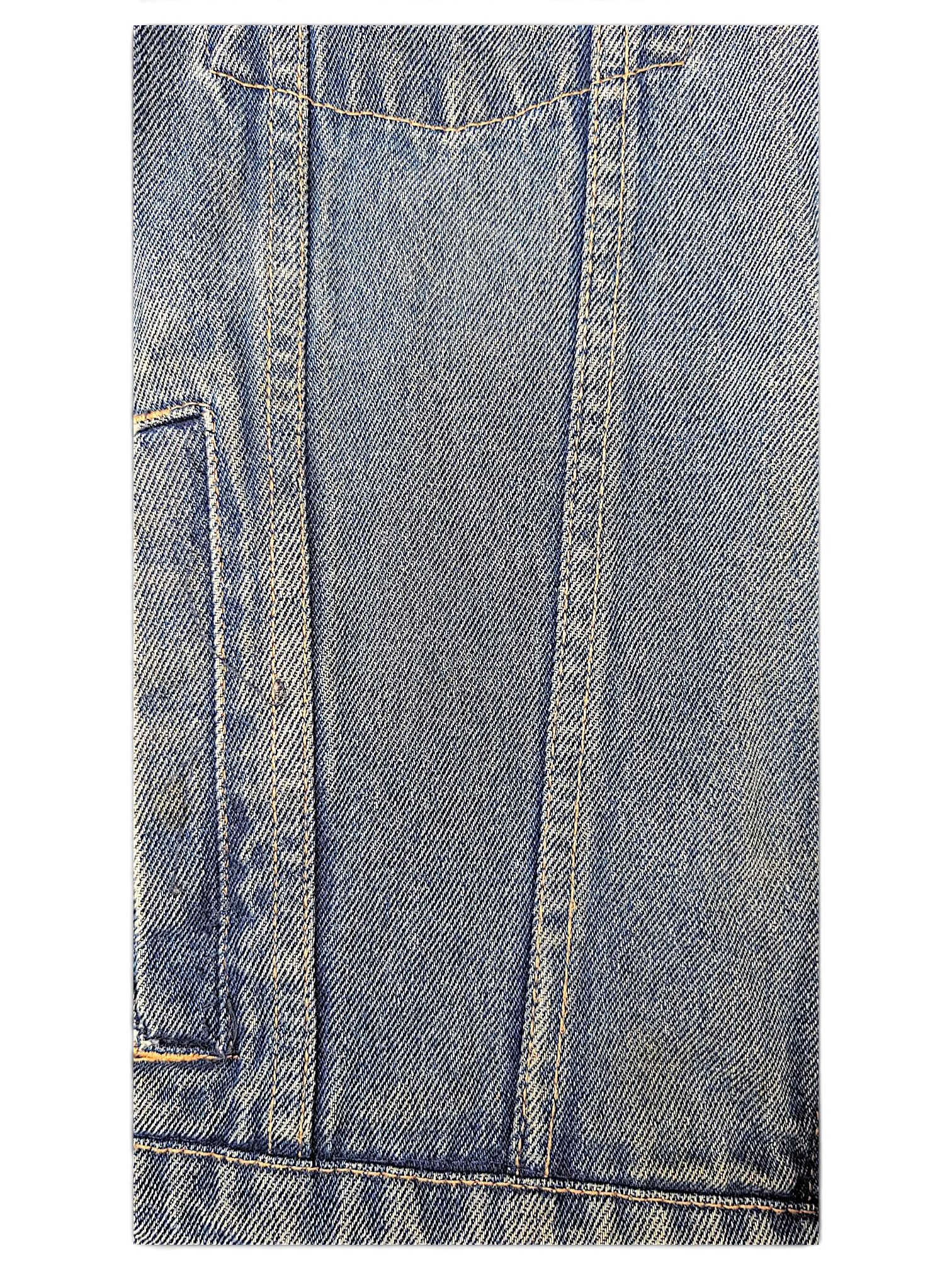 Close-up of JAKE & IPI Wrangler Hero denim jacket featuring blue cotton fabric with contrast orange stitching.