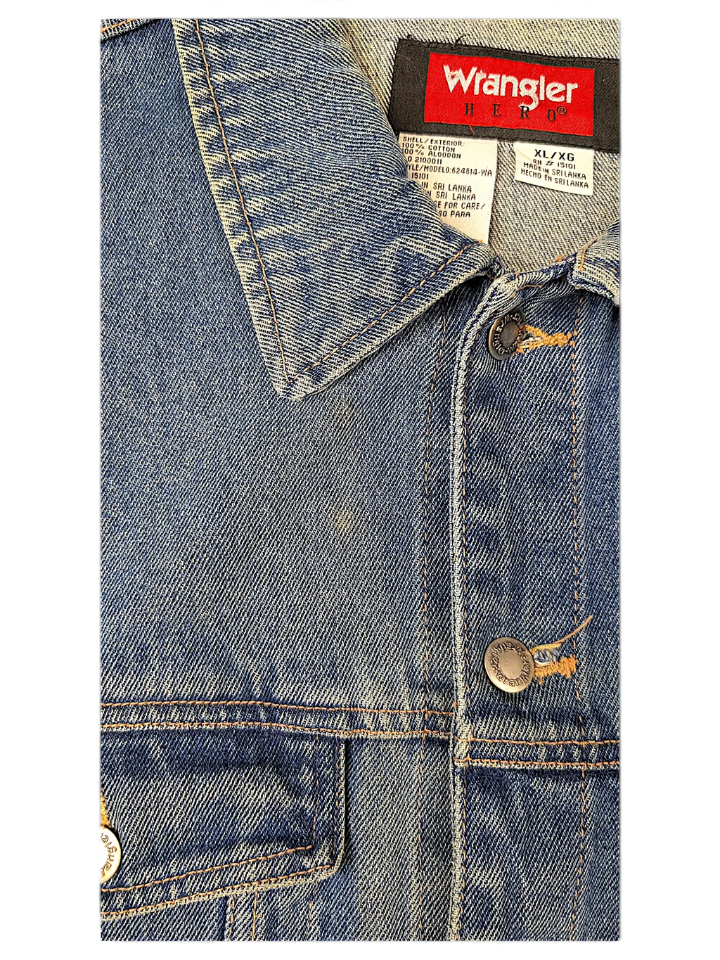 JAKE & IPI Wrangler Hero blue denim jacket featuring a classic collar, metal buttons, and interior brand label.