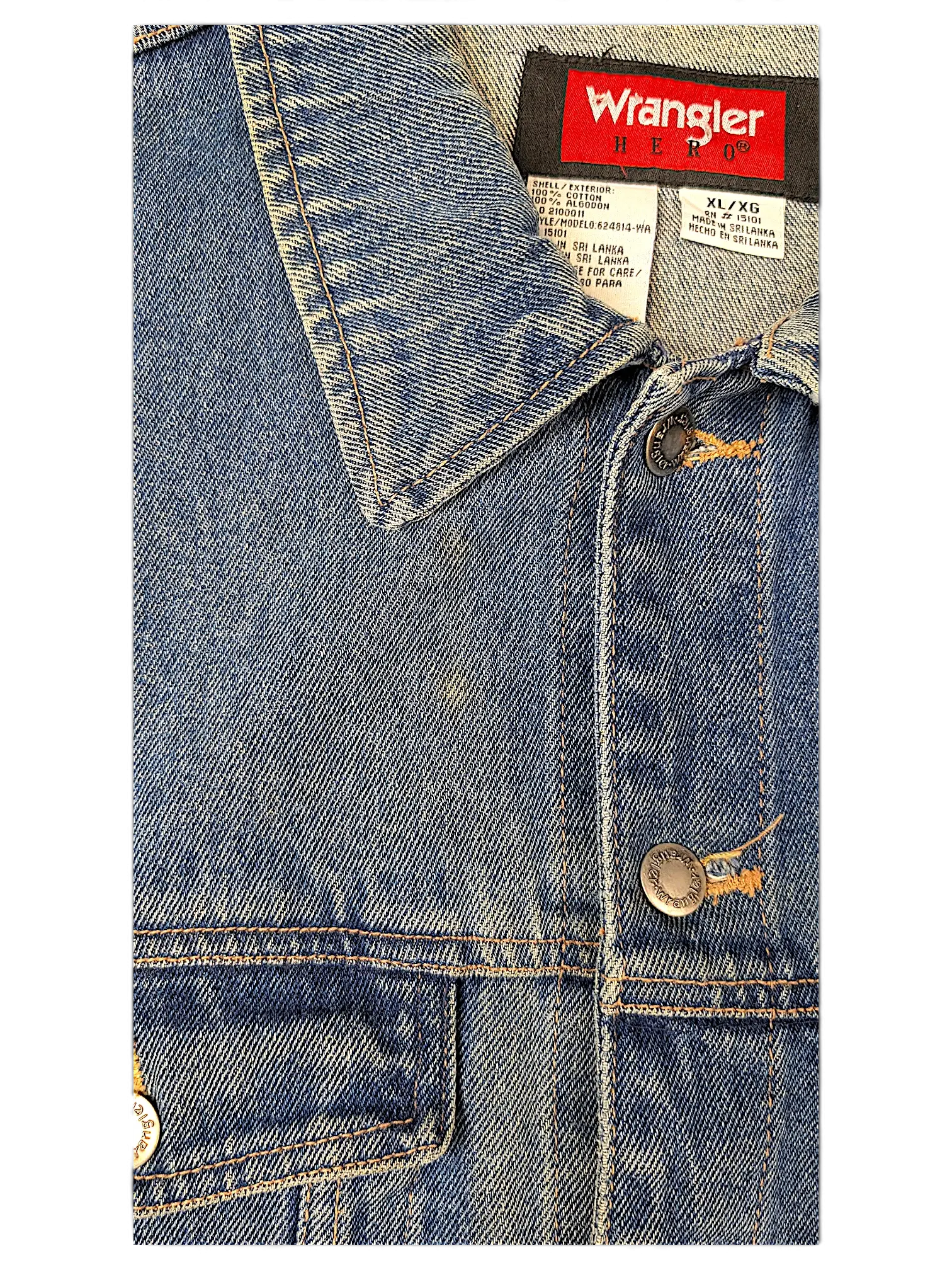 JAKE & IPI Wrangler Hero blue denim jacket featuring a classic collar, metal buttons, and interior brand label.