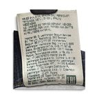 JAKE & IPI Wrangler jeans care label with manufacturing and import information in multiple languages